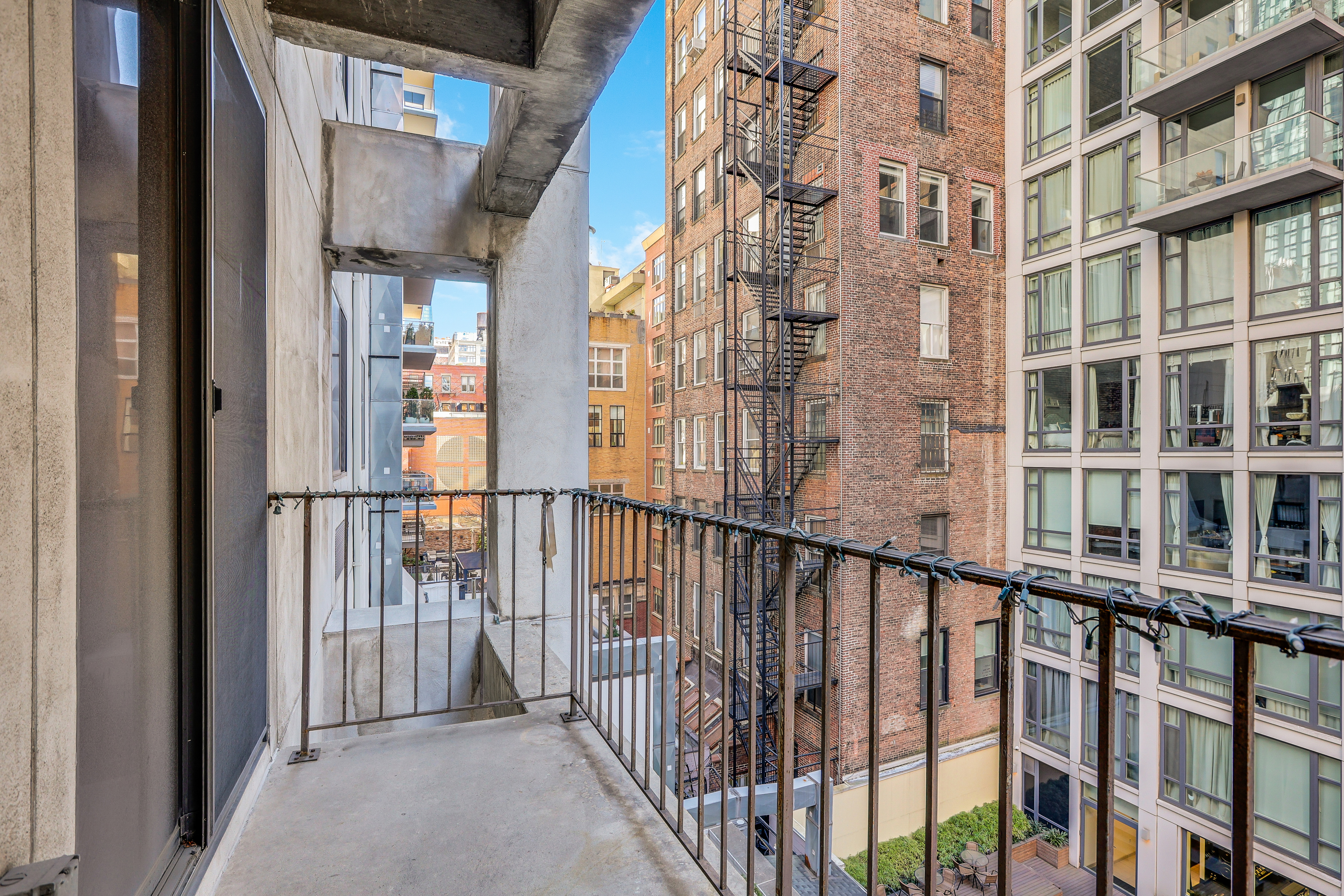 136-140 West 23rd Street, Unit 4C Manhattan, NY 10011 - Photo 11 of 12 a view of buildings from balcony