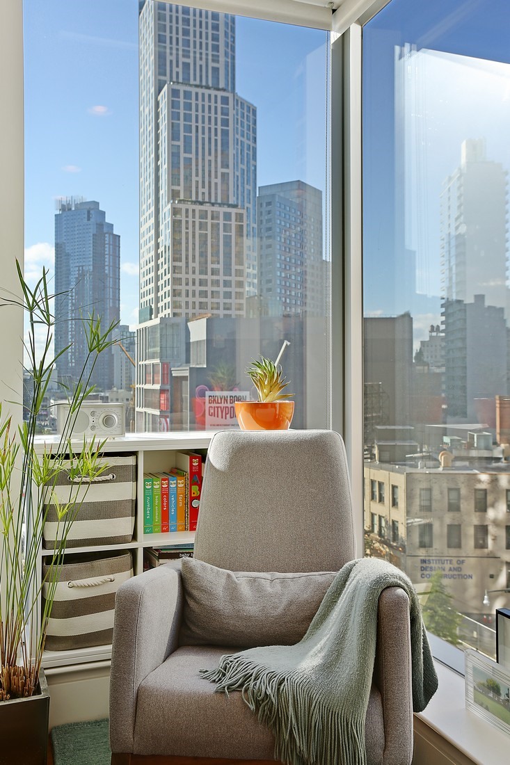 150 Myrtle Avenue, Unit 806 Brooklyn, NY 11201 - Photo 5 of 22 a living room with furniture and a floor to ceiling window