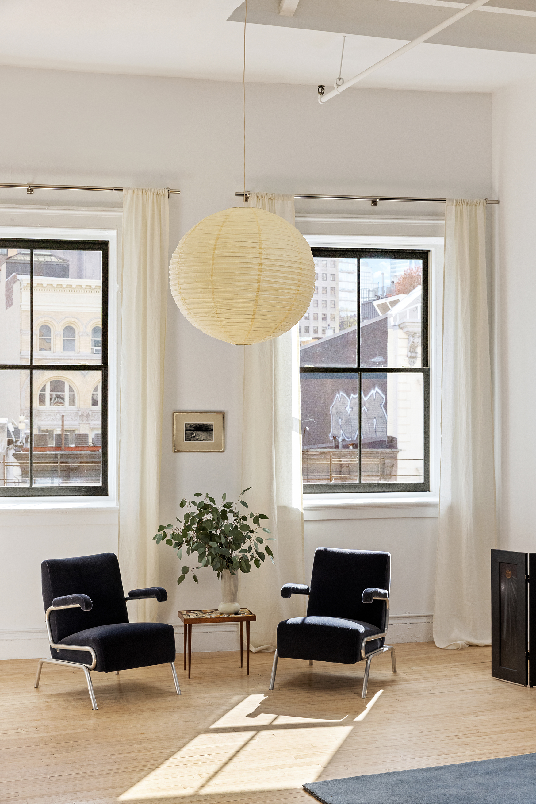 47 Howard Street, Unit PH Manhattan, NY 10013 - Photo 12 of 14 a living room with furniture and a window