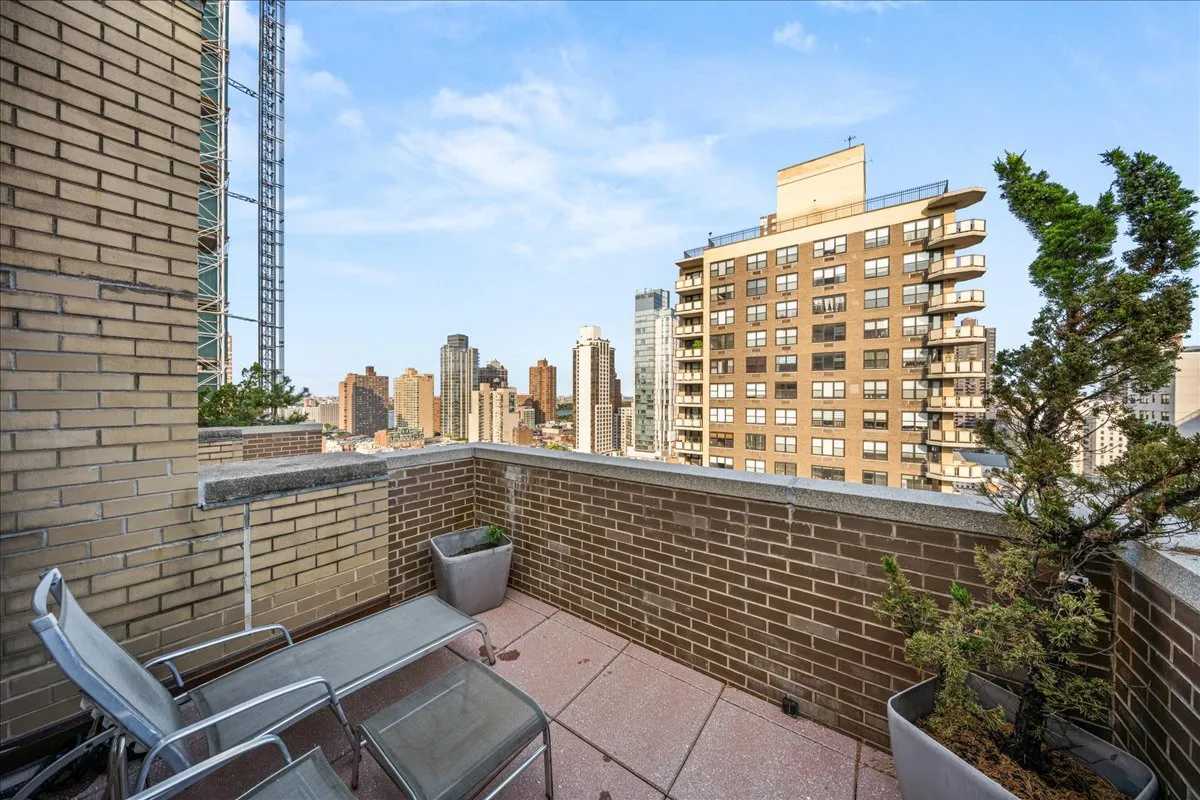 a view of a balcony with city view