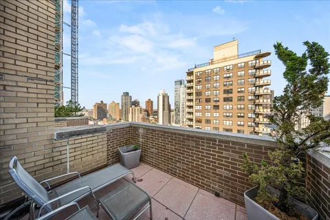 a view of a balcony with city view