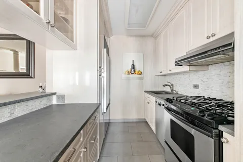 a kitchen with a stove and a sink