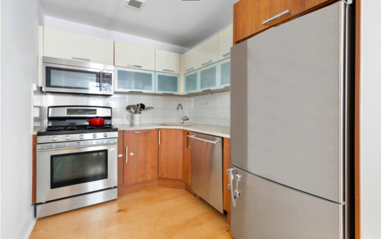 343 4th Avenue, Unit 2C Brooklyn, NY 11215 - Photo 2 of 12 a kitchen with stainless steel appliances granite countertop a stove and a refrigerator