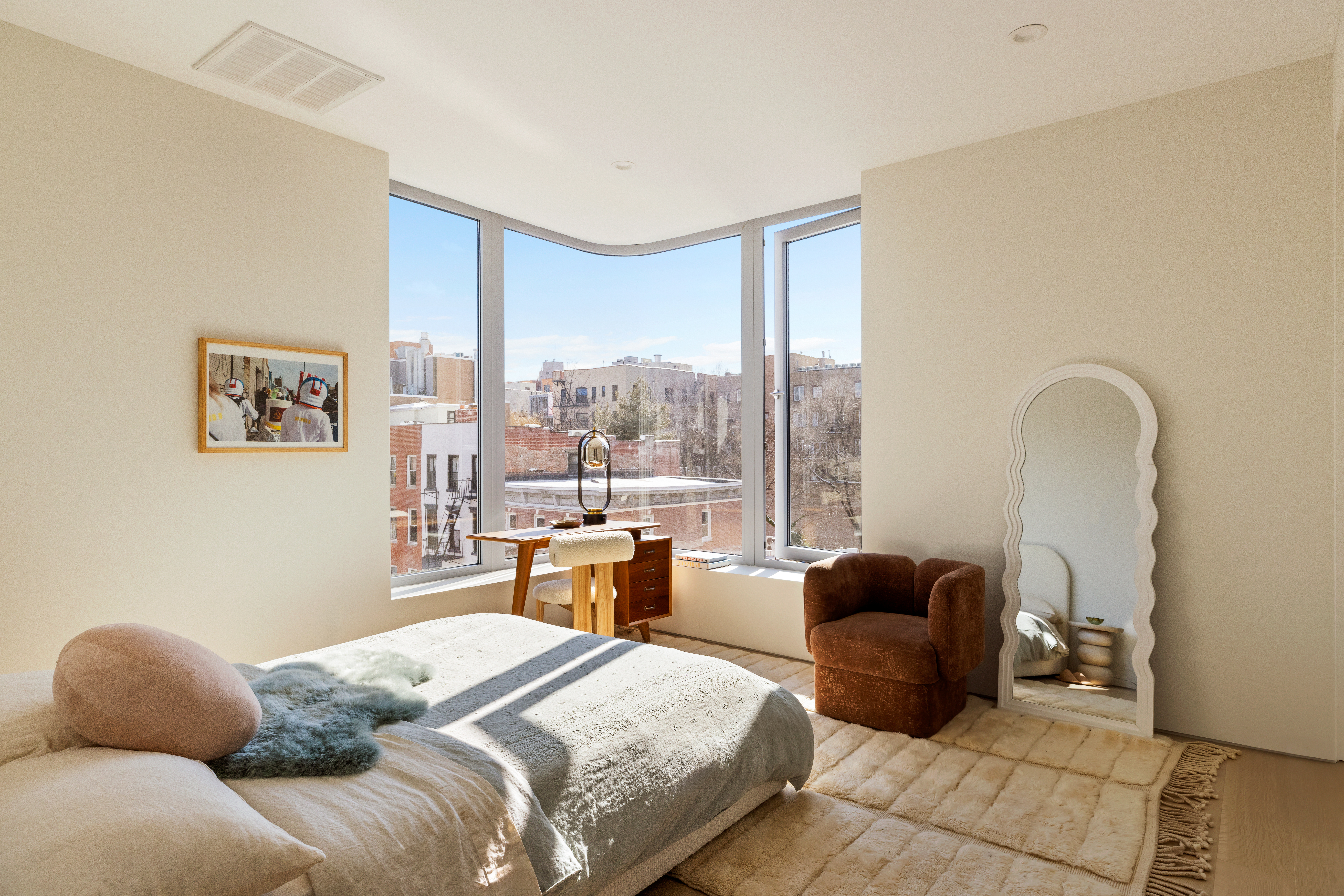 276 Berry Street Brooklyn, NY 11249 - Photo 23 of 36 a bedroom with bed couch and window