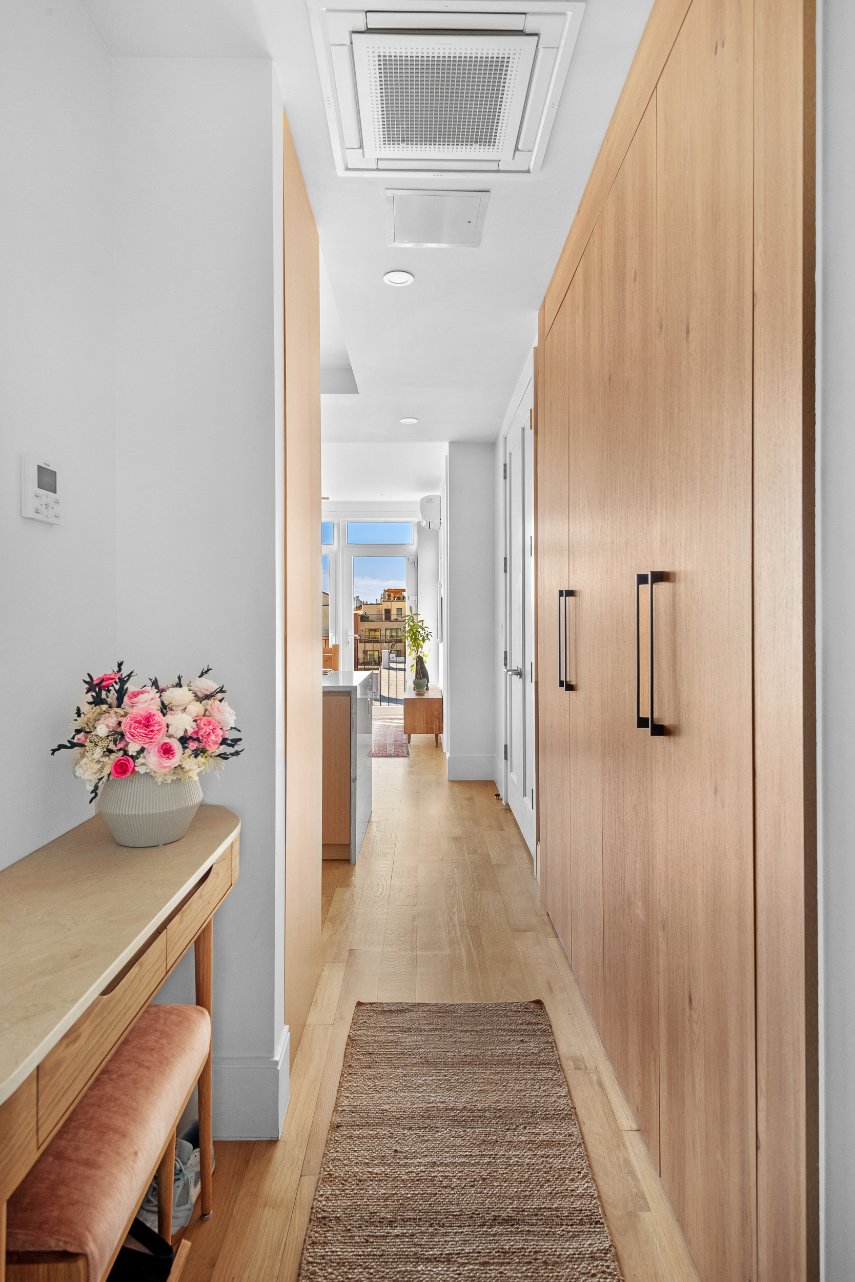183 Mc Guinness Boulevard, Unit 6C Brooklyn, NY 11222 - Photo 8 of 12 a view of a hallway view with dining room and wooden floor