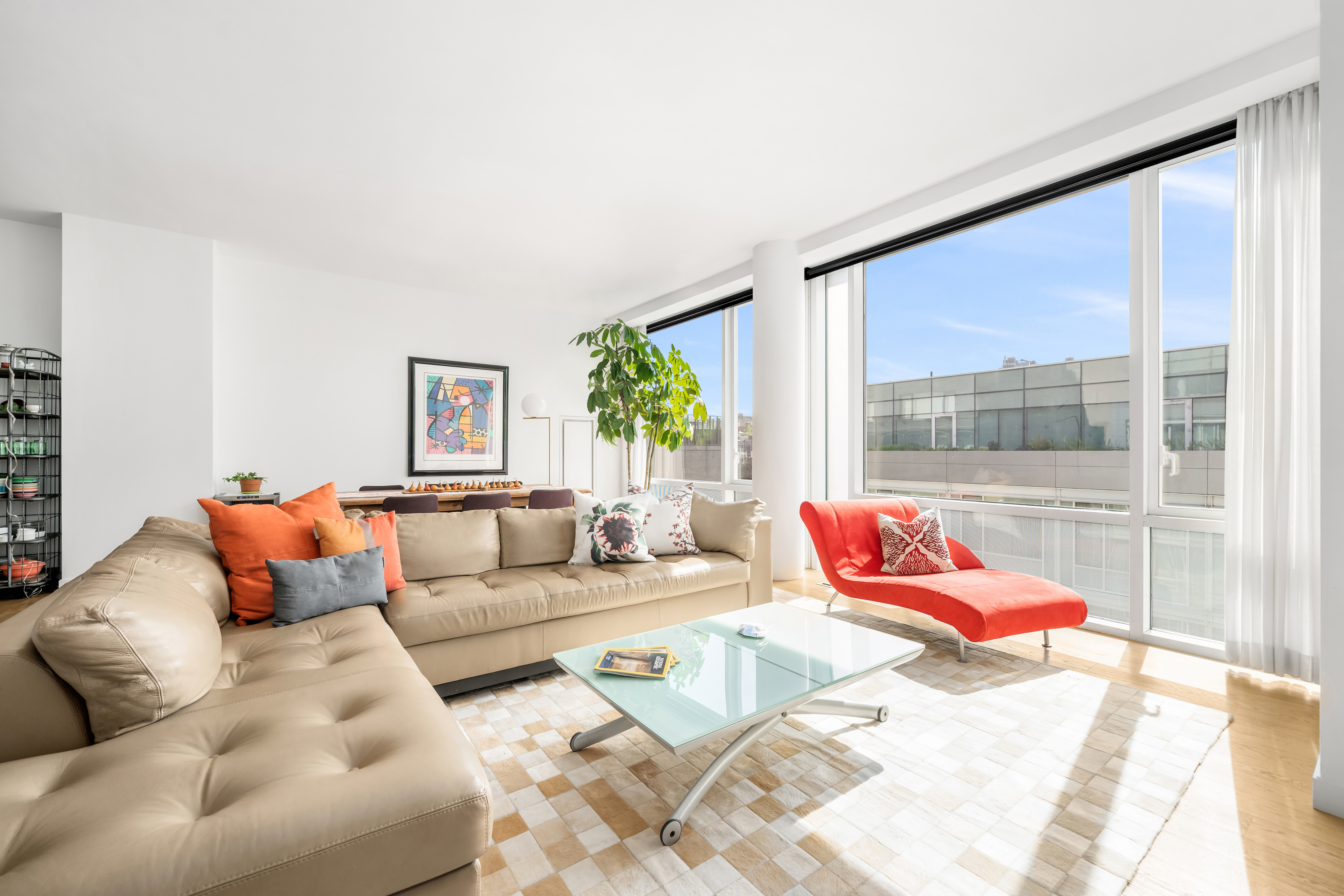 311 West Broadway, Unit 8A Manhattan, NY 10013 - Photo 2 of 10 a living room with furniture and a large window