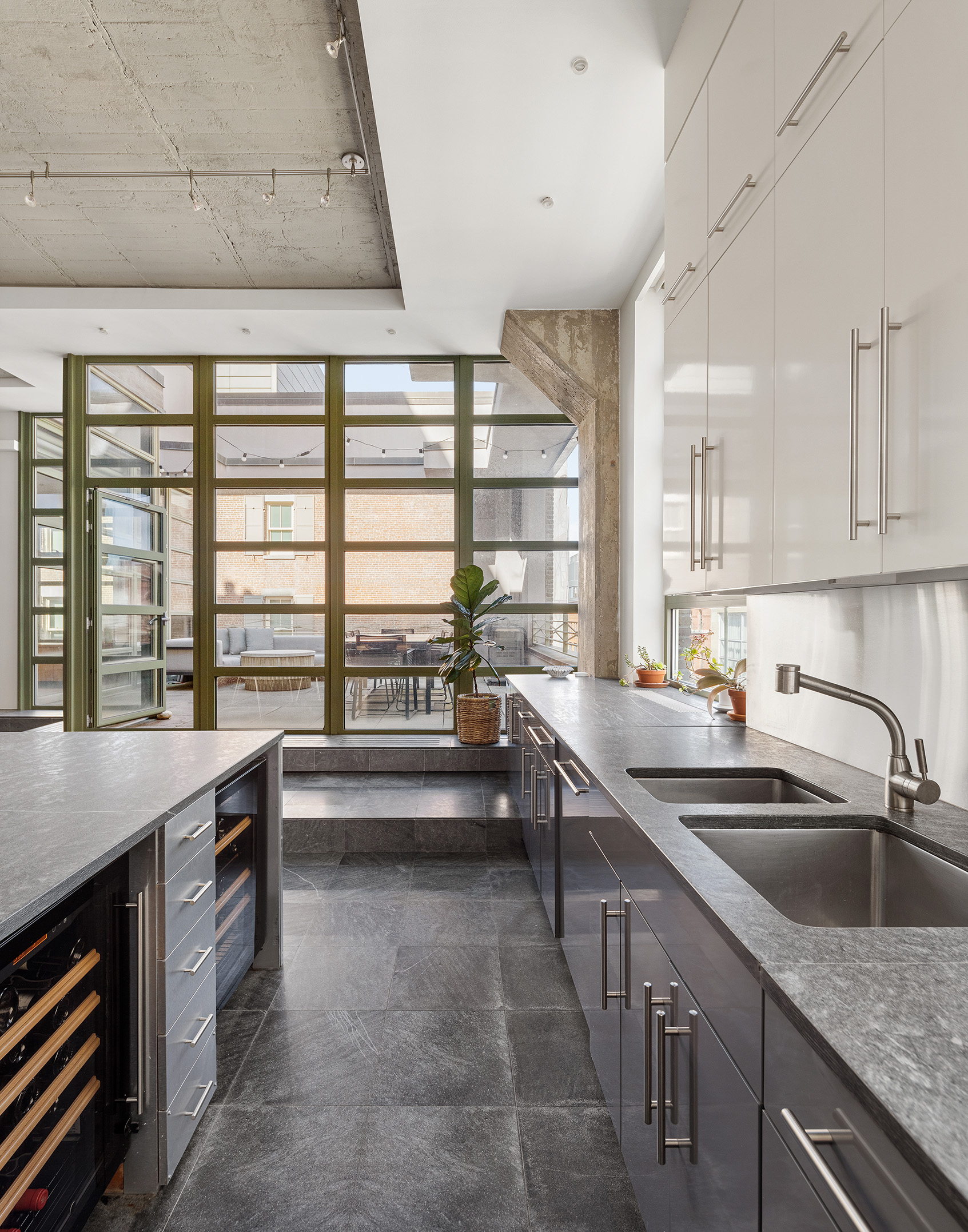 195 Hudson Street, Unit 6A Manhattan, NY 10013 - Photo 6 of 15 a kitchen with a sink and a large window