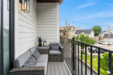 a balcony view with a potted plant