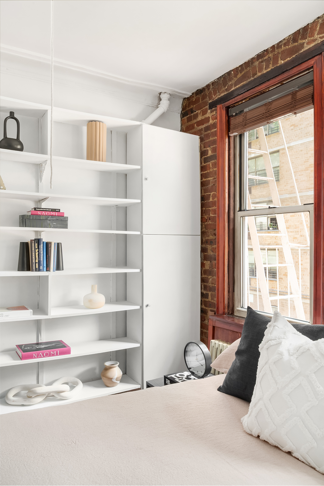 626 East 14th Street, Unit 8 Manhattan, NY 10009 - Photo 13 of 14 a bedroom with a bed and a window