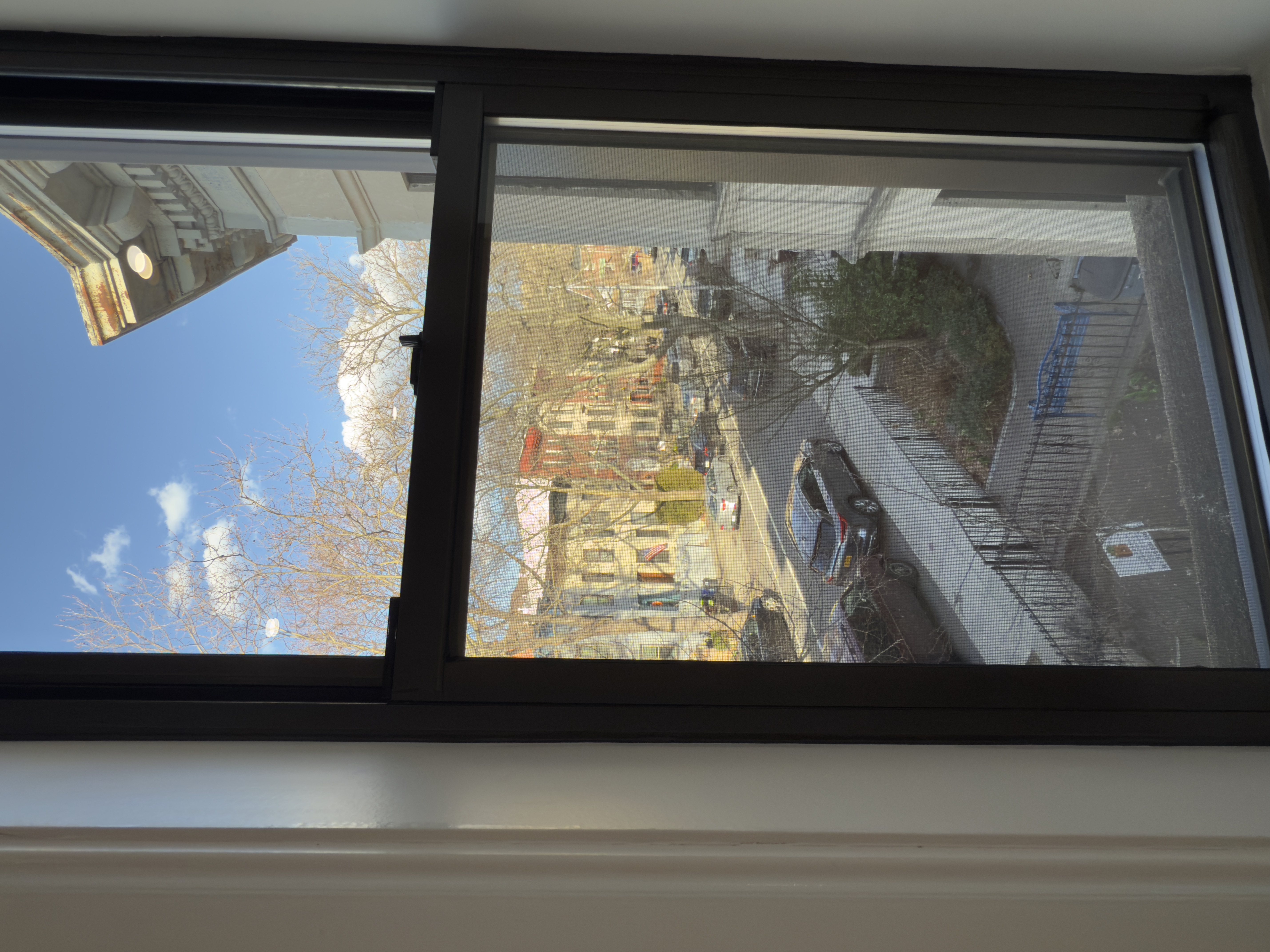 82 74th Street Brooklyn, NY 11209 - Photo 13 of 21 a view of a glass door with a floor to ceiling window