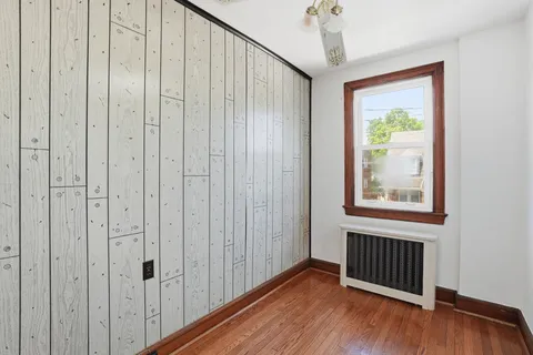 a view of an entryway with wooden floor