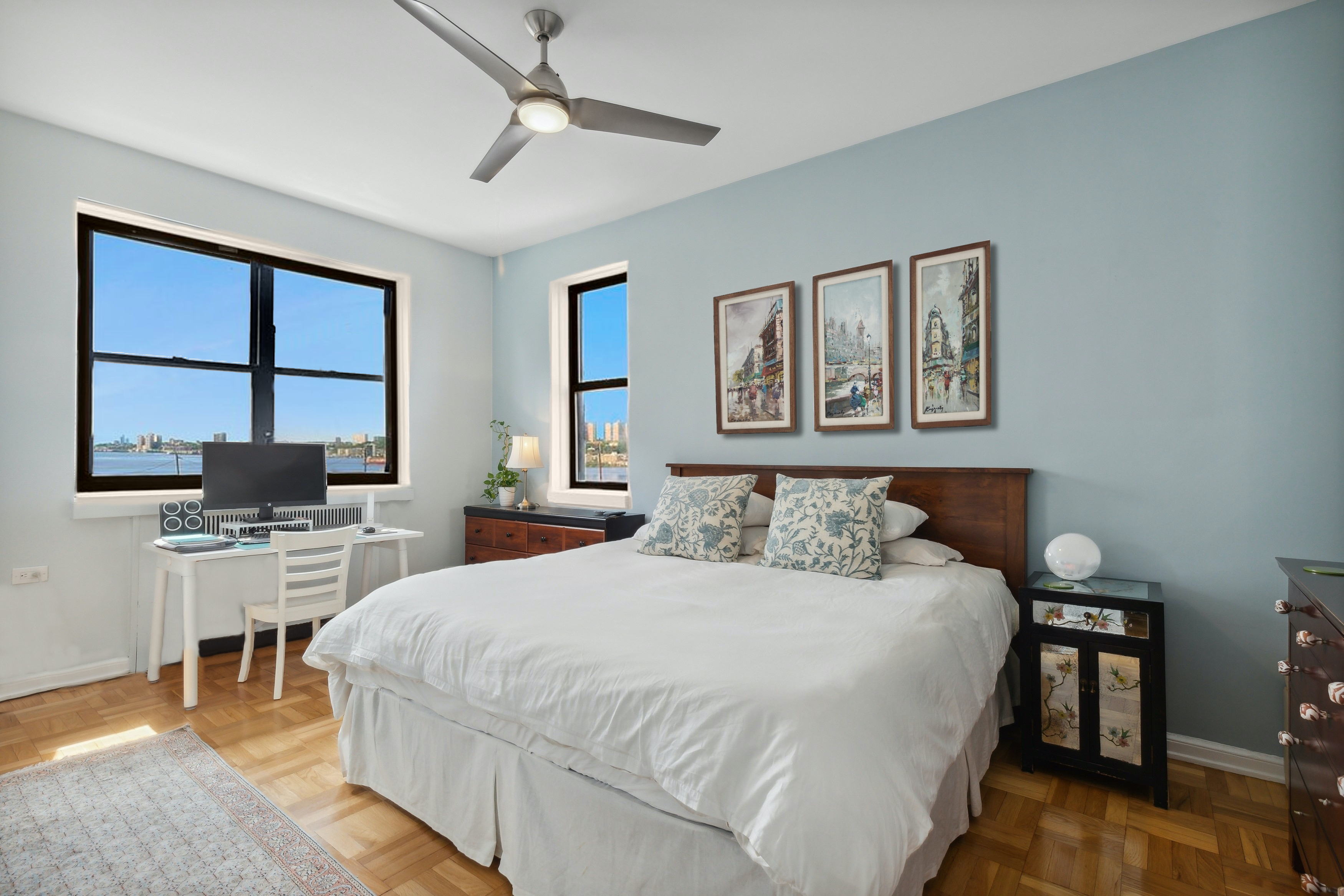 158-18 Riverside Drive West, Unit 2E Manhattan, NY 10032 - Photo 8 of 22 a bedroom with a bed a desk and chair