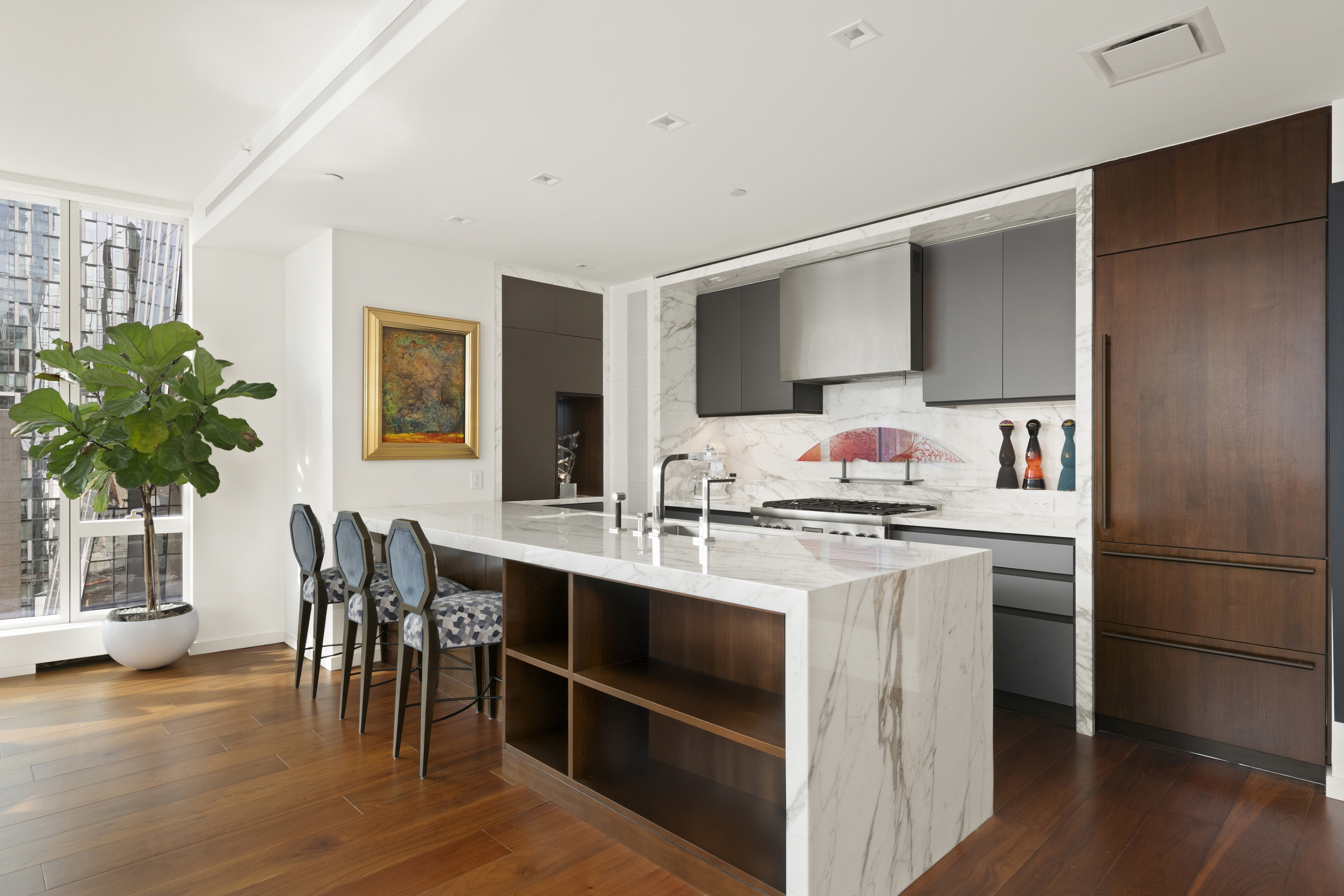 1 West End Avenue, Unit 19J Manhattan, NY 10023 - Photo 6 of 32 a kitchen with stainless steel appliances a stove refrigerator sink and cabinets