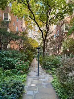 a picture of a bench in front of a wall