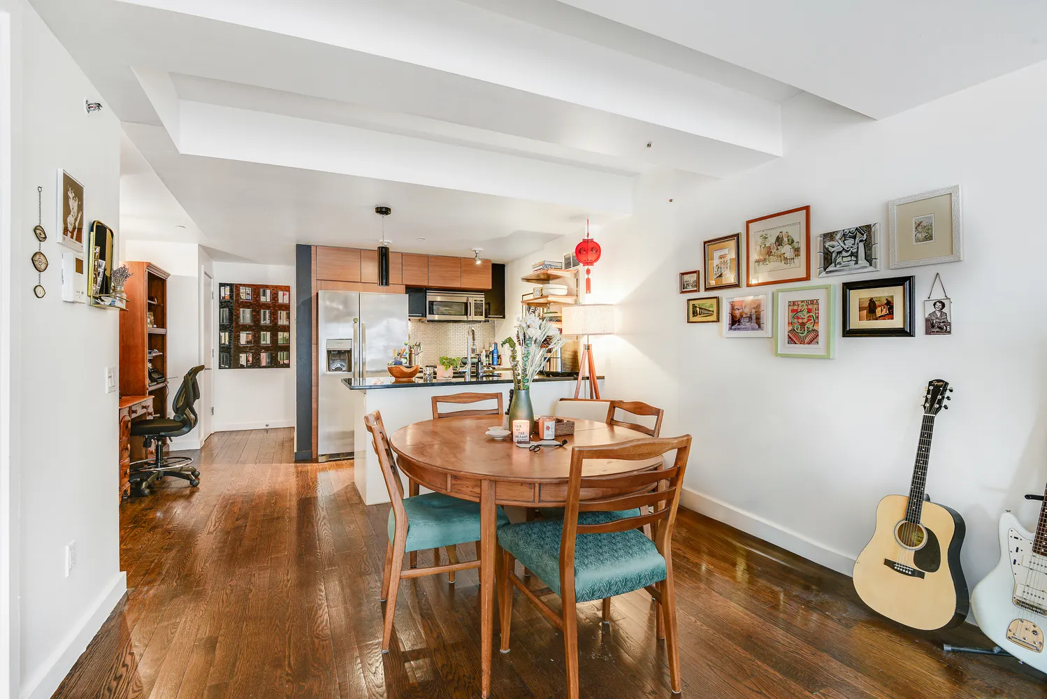 a dining room with wooden floor and breakfast area