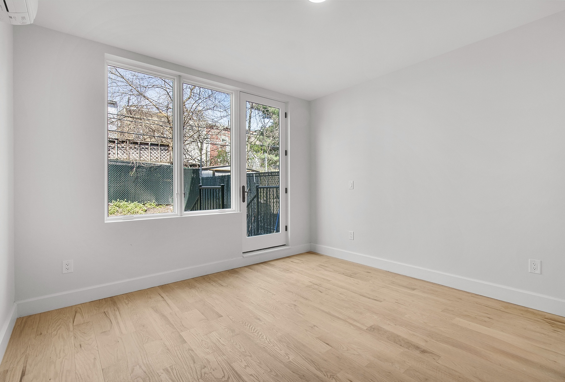 1098 Madison Street, Unit 1B Brooklyn, NY 11221 - Photo 4 of 16 a view of an empty room with a window