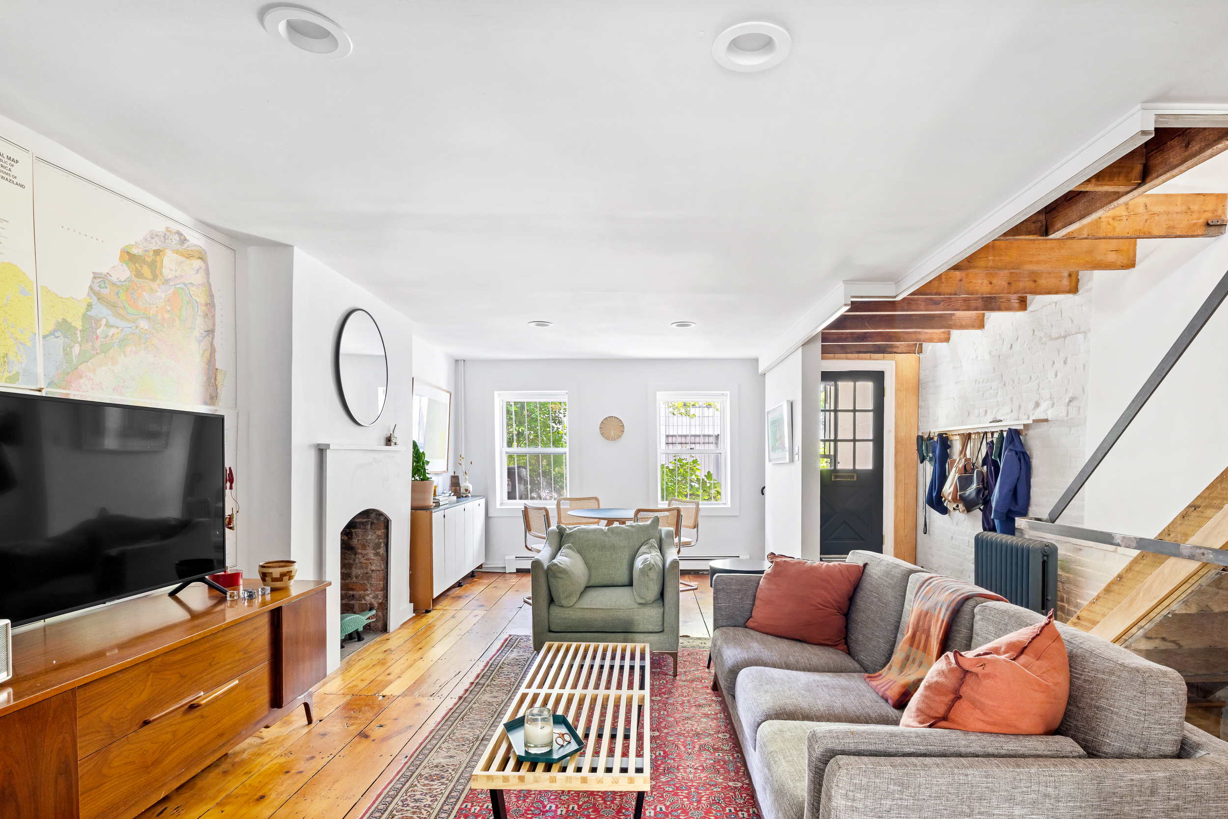 437 Warren Street Brooklyn, NY 11217 - Photo 1 of 17 a living room with furniture and a flat screen tv