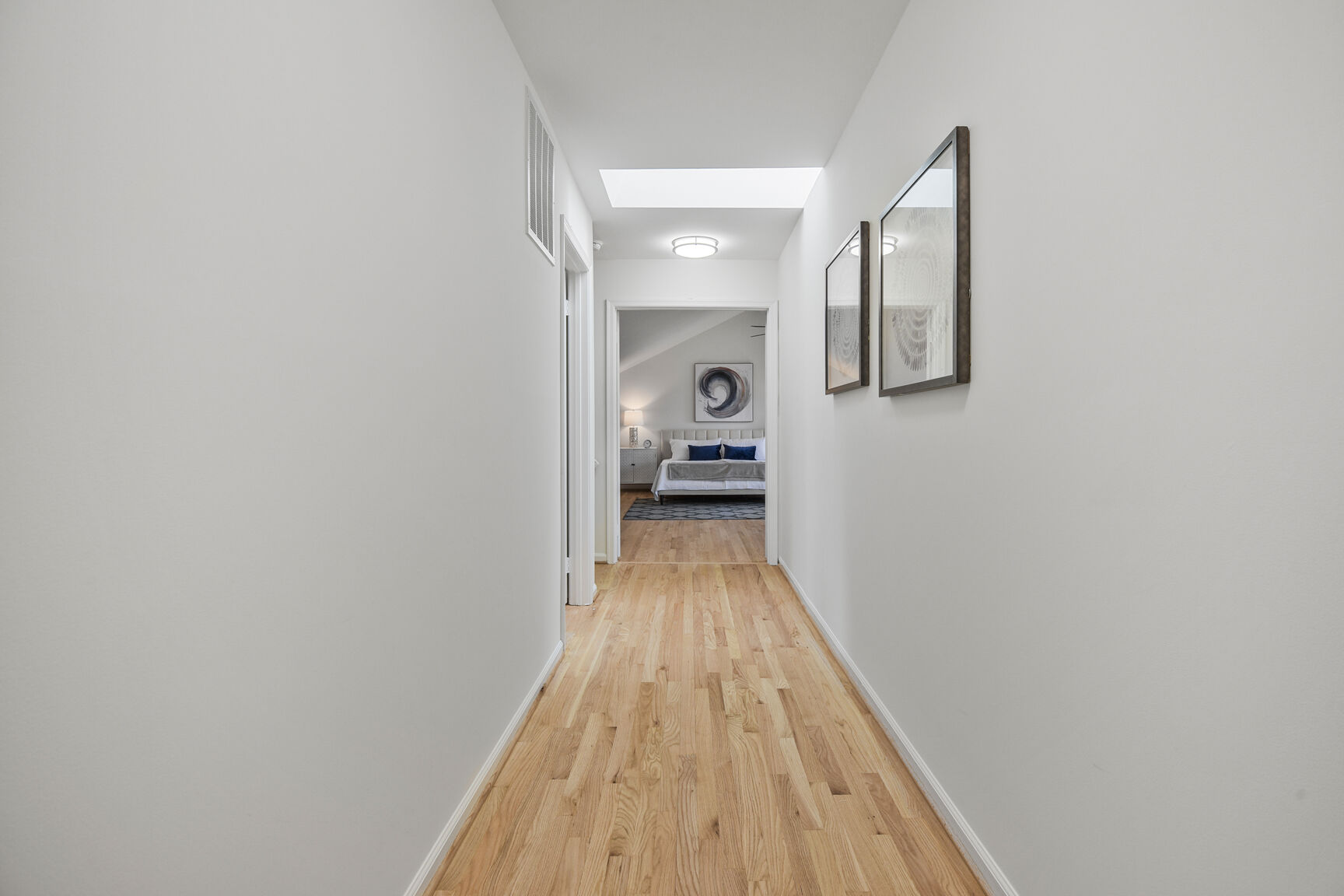 4008 Evangeline Terrace Olney, MD 20832 - Photo 35 of 54 a view of a hallway with wooden floor and a bathroom