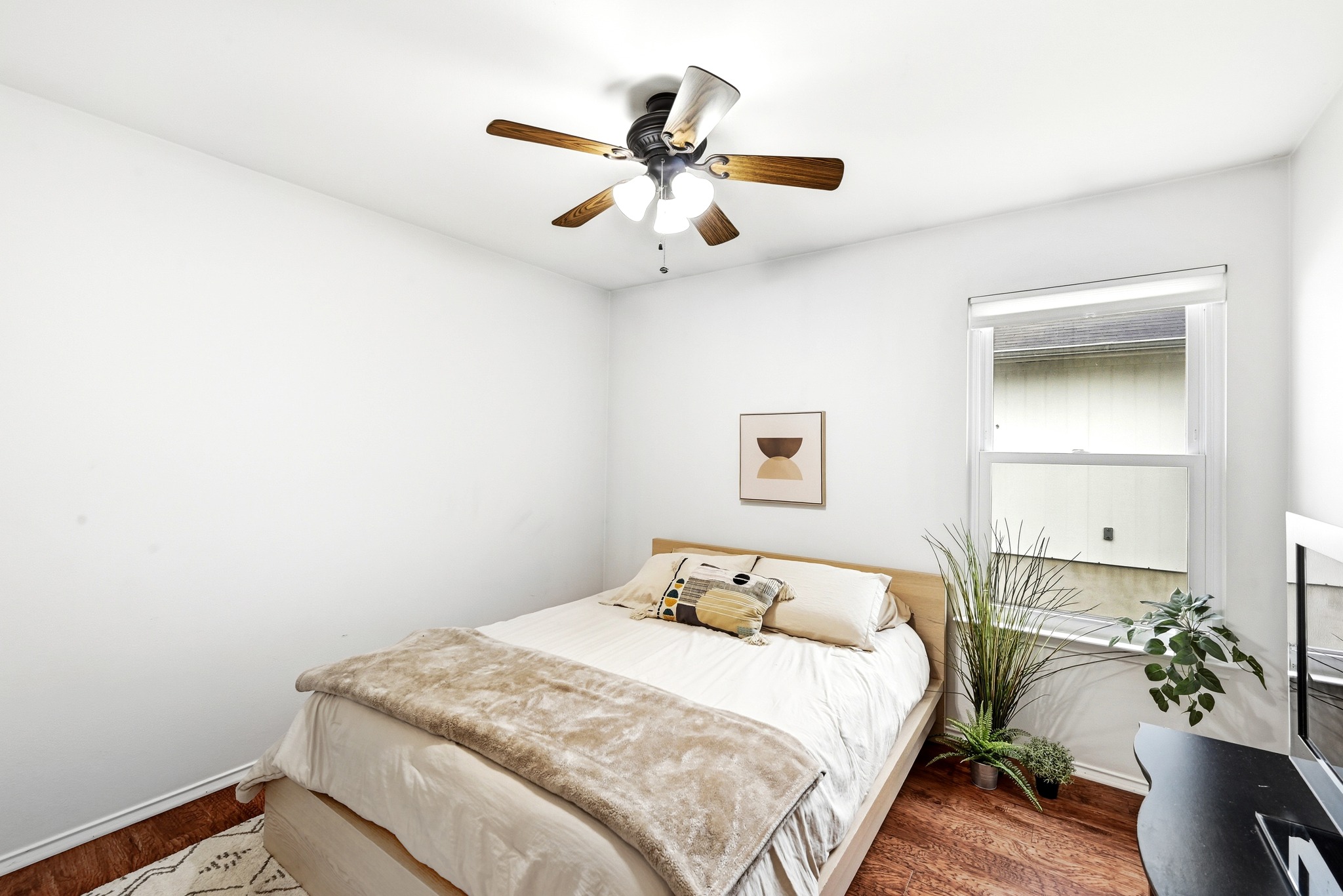 8901 Frock Court Austin, TX 78748 - Photo 21 of 28 a bedroom with a bed and a potted plant