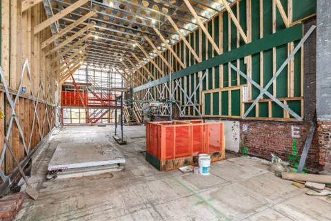 a view of entryway with brick walls