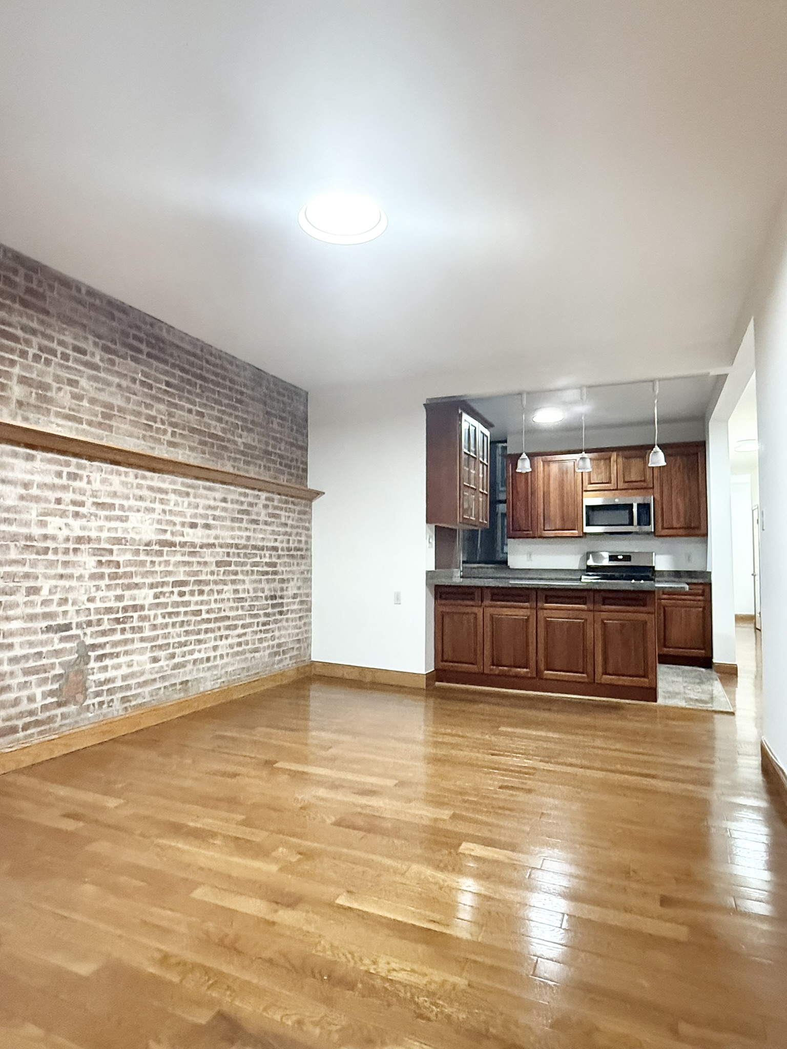 839 West End Avenue, Unit 3D Manhattan, NY 10025 - Photo 3 of 10 a view of kitchen with wooden floor and large window