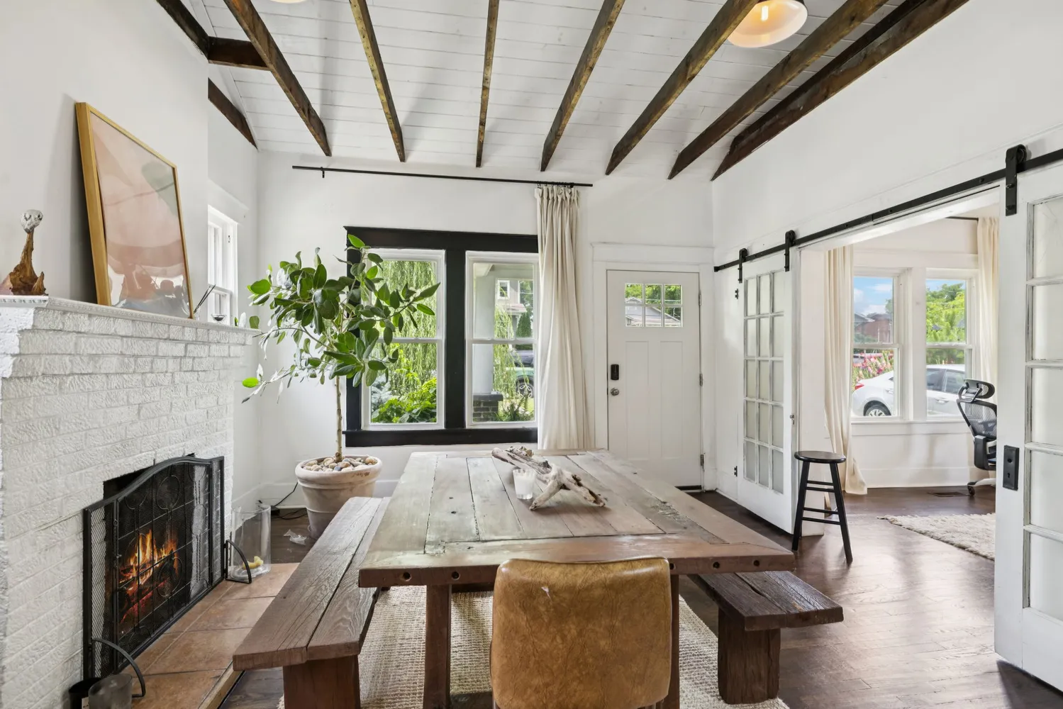 a view of a livingroom with furniture window and wooden floor