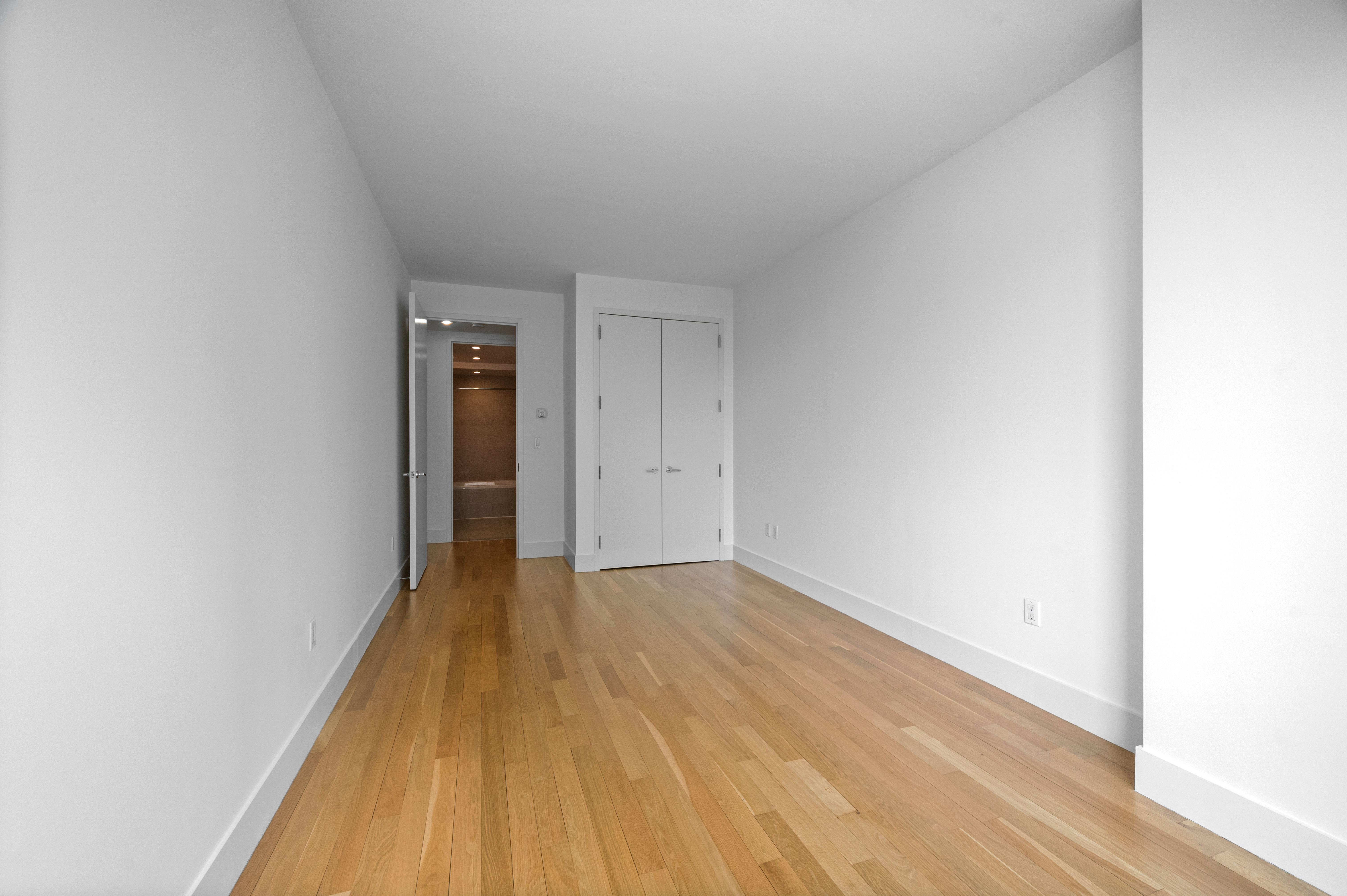 117 West 123rd Street, Unit 5D Manhattan, NY 10027 - Photo 11 of 18 a view of a hallway with wooden floor