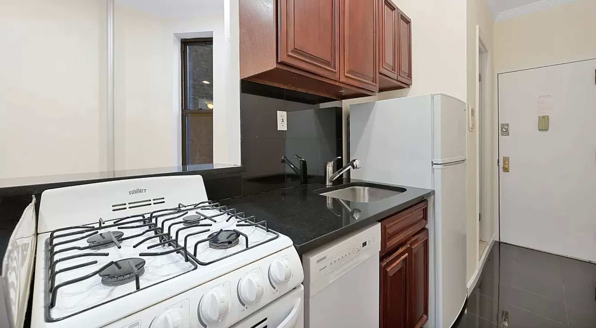370 Columbus Avenue, Unit 4F Manhattan, NY 10024 - Photo 3 of 13 a kitchen with a stove and a refrigerator