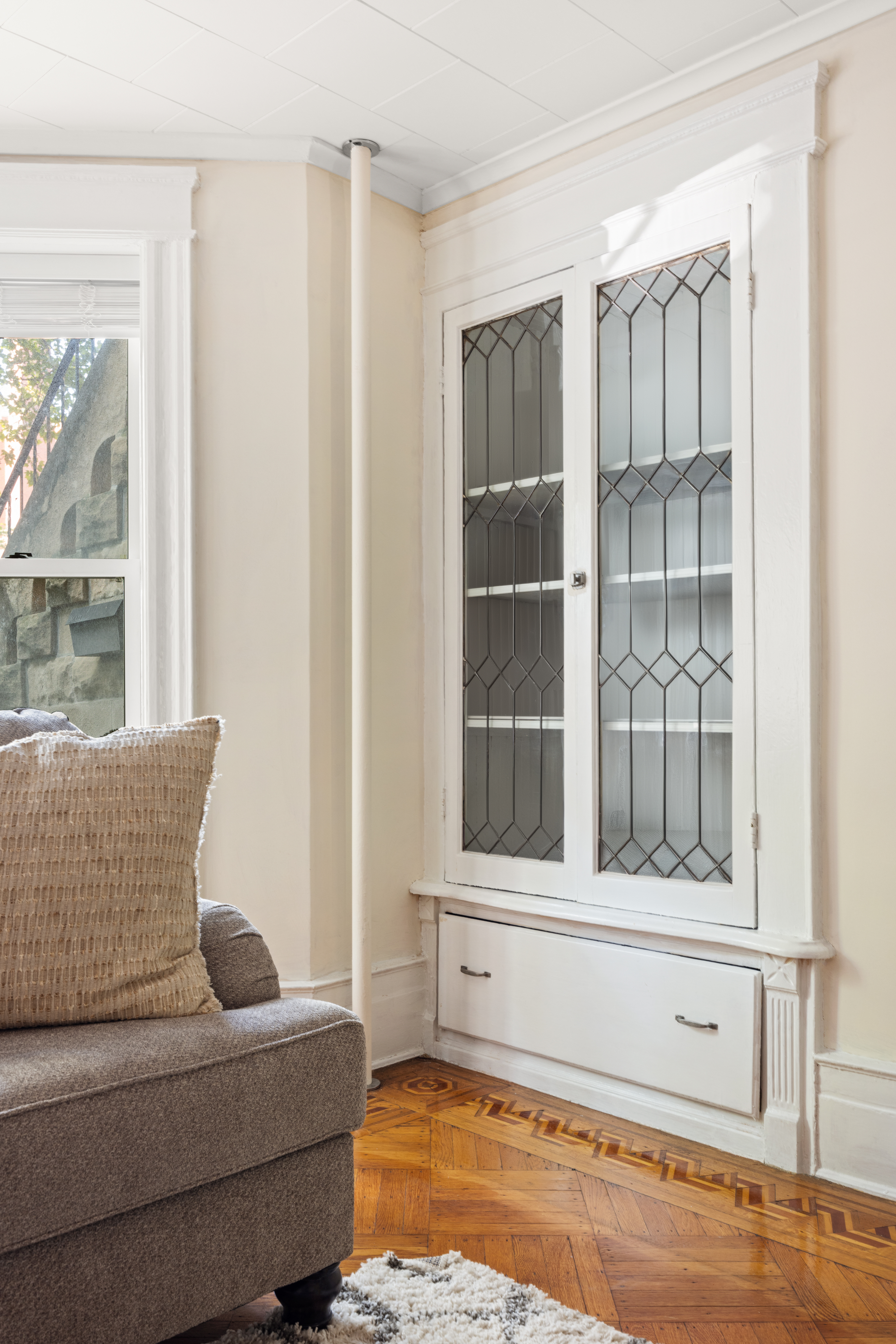273 Windsor Place Brooklyn, NY 11218 - Photo 27 of 29 a living room with furniture and a window