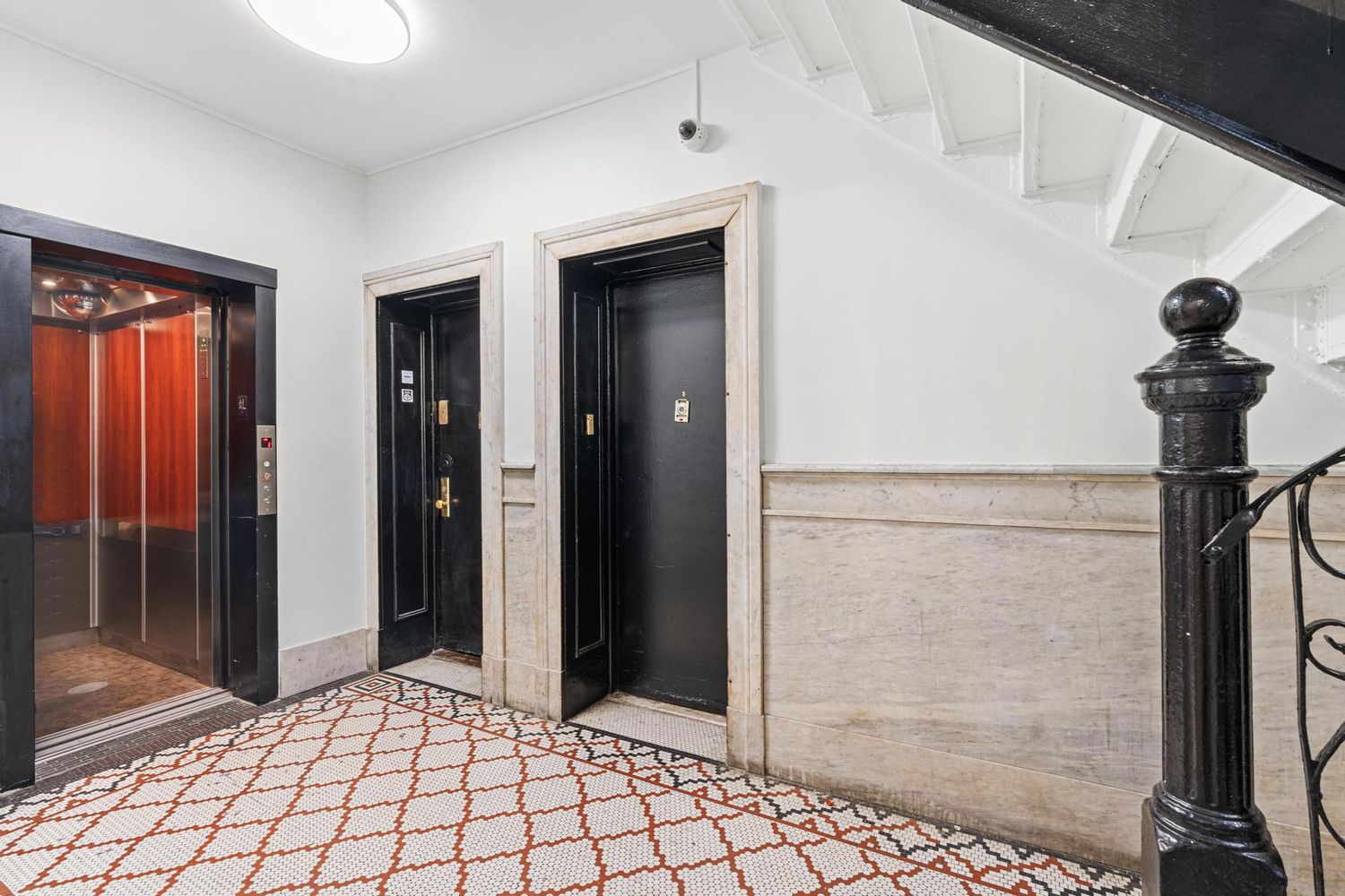 527 West 143rd Street, Unit 31 Manhattan, NY 10031 - Photo 28 of 29 a view of a hallway with a chandelier