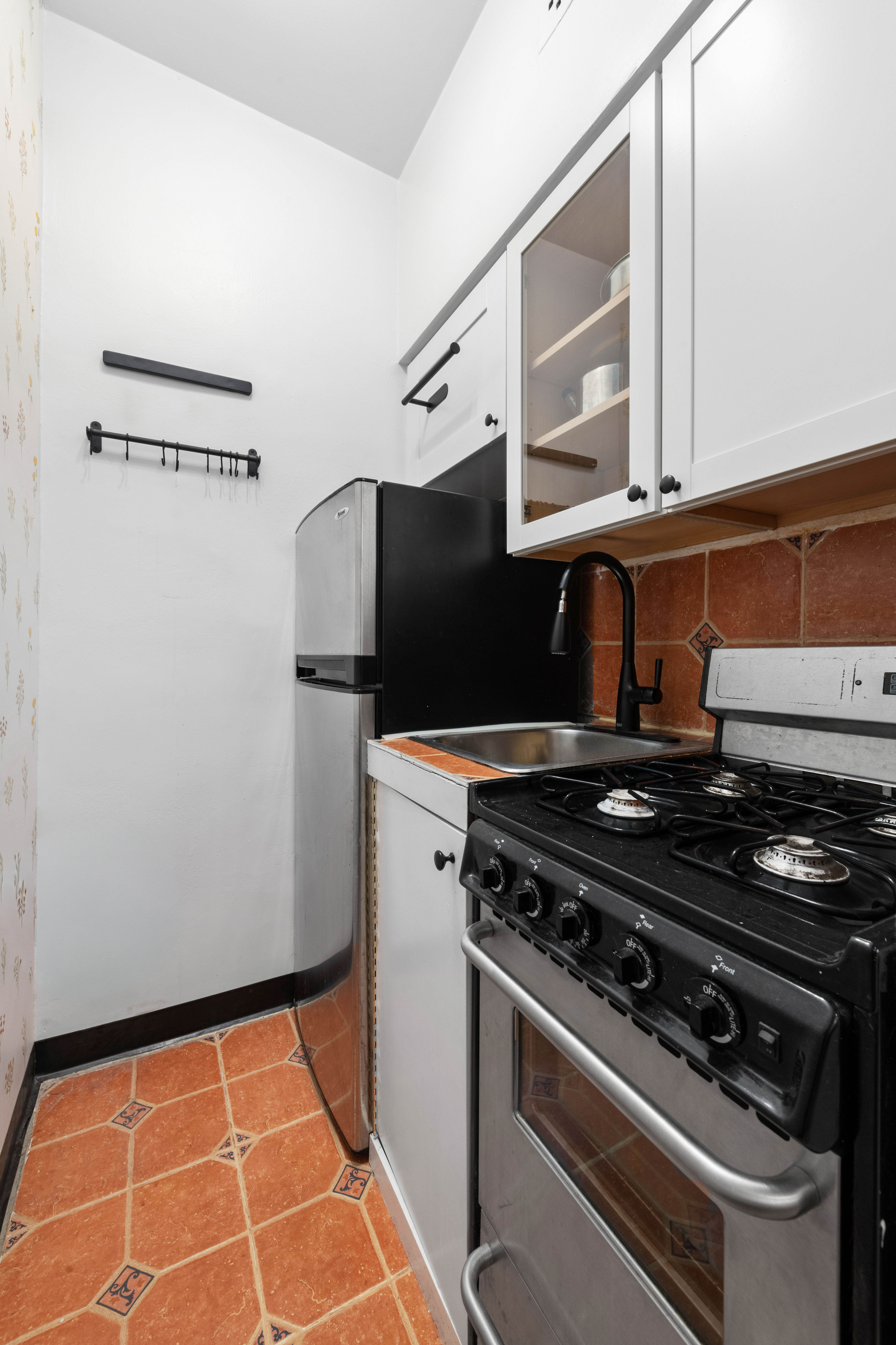 2790 Broadway, Unit 1B Manhattan, NY 10025 - Photo 3 of 8 a stove top oven sitting inside of a kitchen