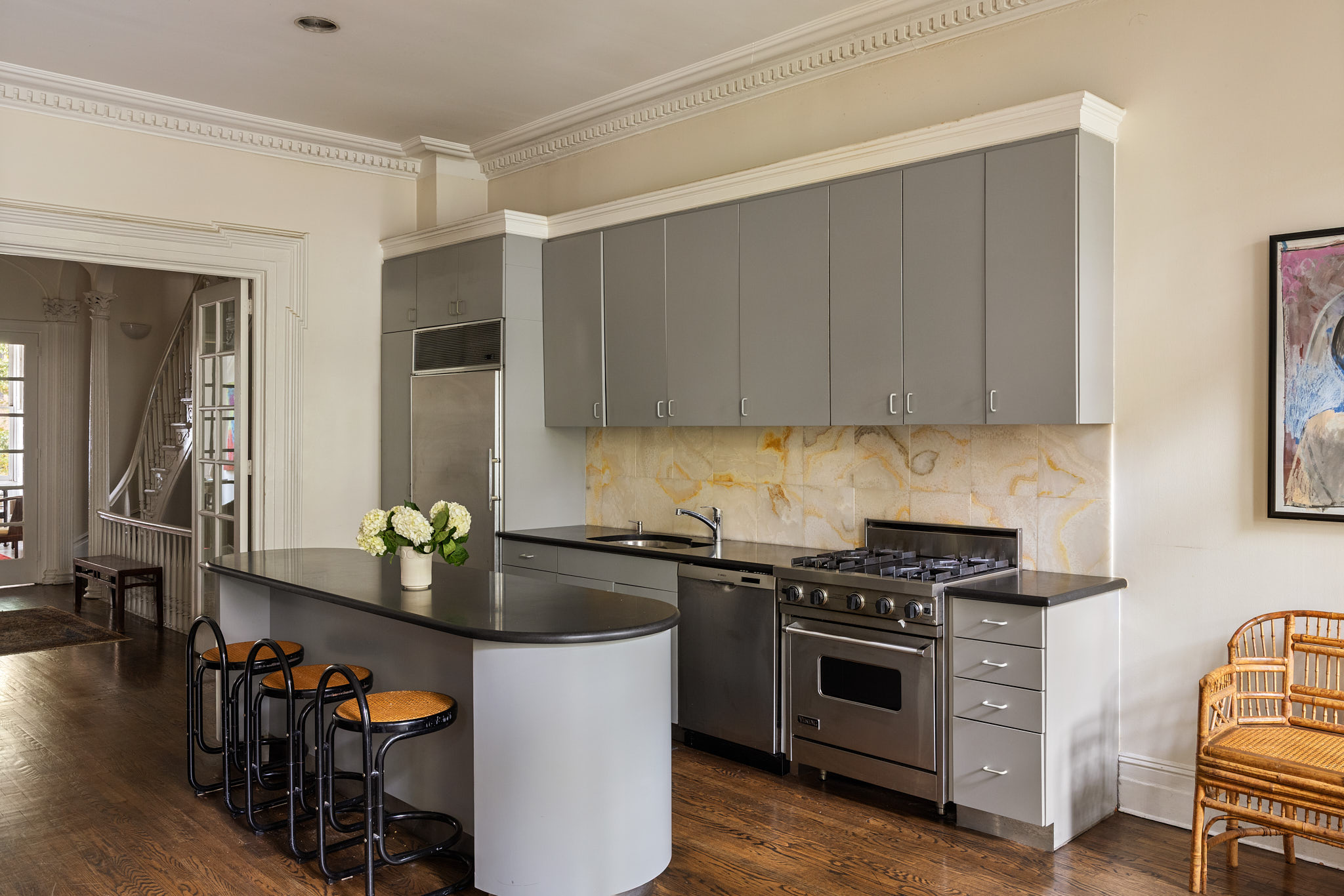 348 West 20th Street Manhattan, NY 10011 - Photo 9 of 18 a kitchen with stainless steel appliances a stove a sink and a refrigerator