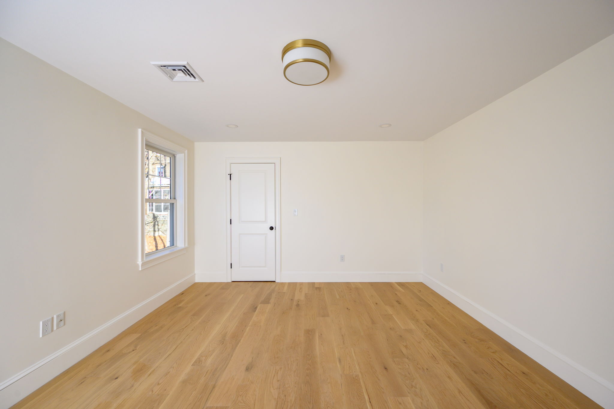 249 Central Avenue Milton, MA 02186 - Photo 37 of 61 a view of room with window and wooden floor