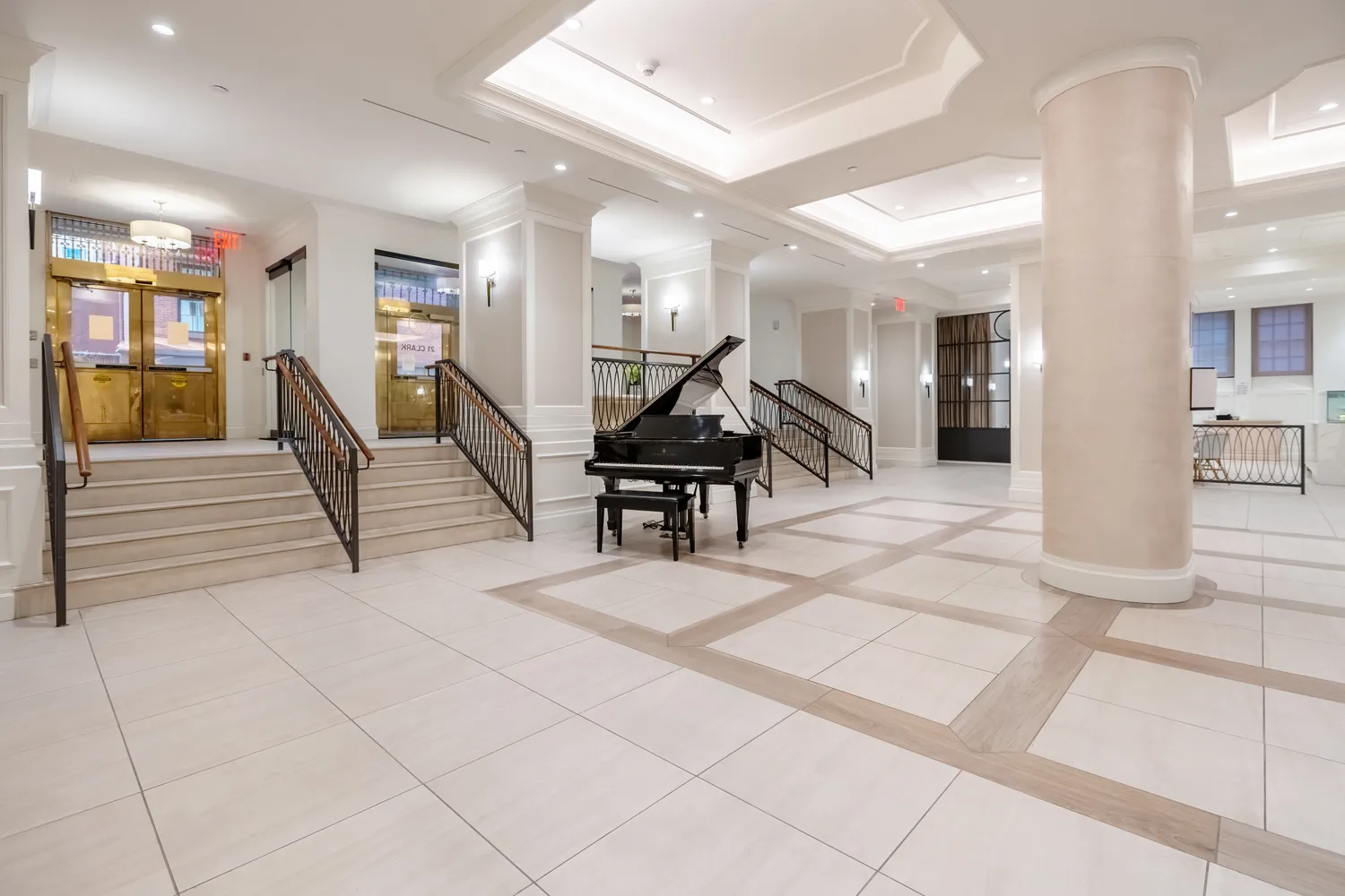 a lobby with furniture and stairs