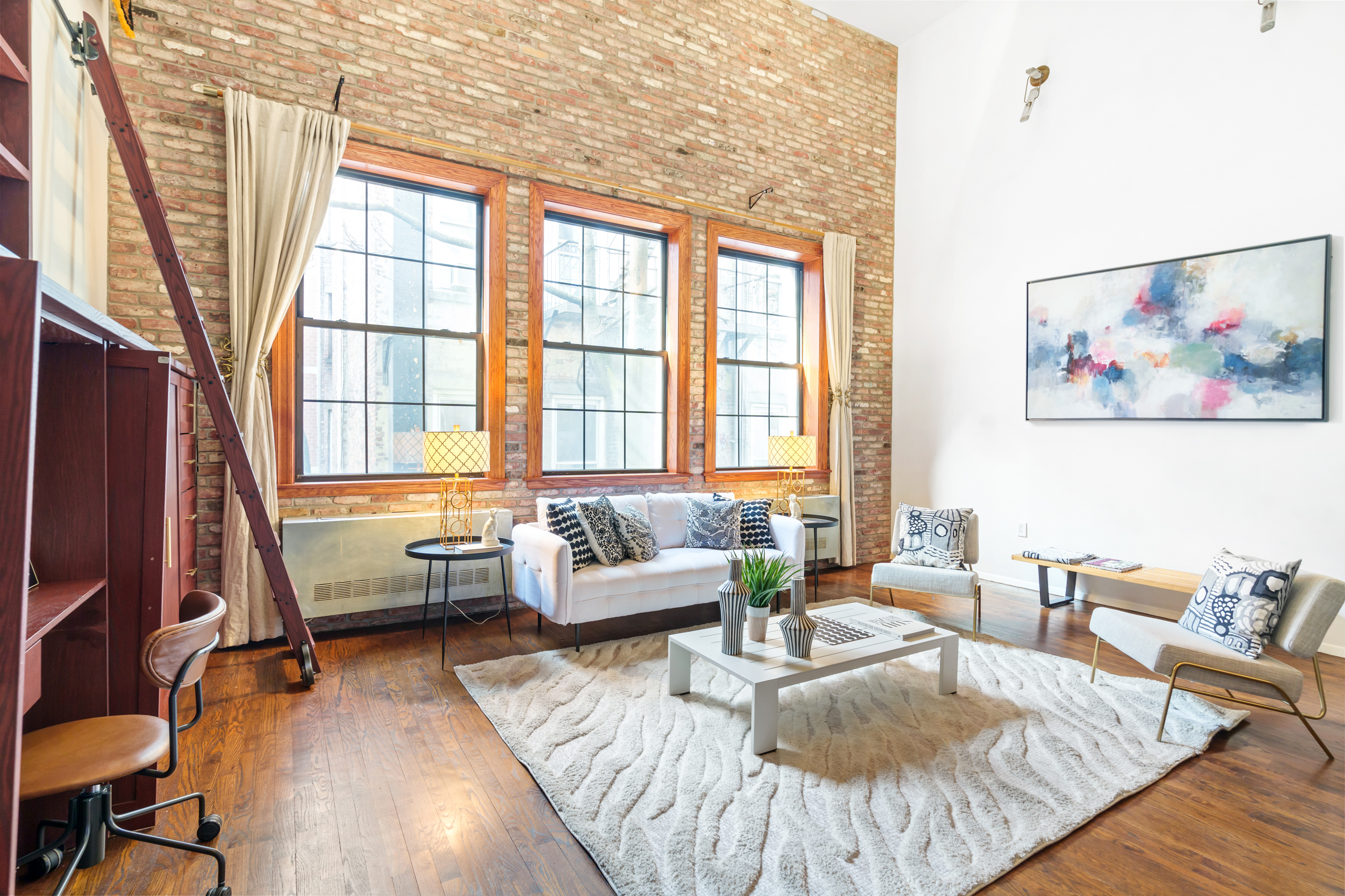 214 East 9th Street, Unit PH4D Manhattan, NY 10003 - Photo 4 of 15 a living room with furniture and a large window