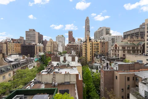 a view of city and a tall buildings