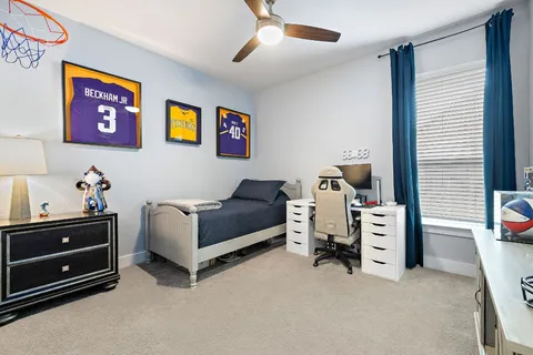 a bedroom with furniture and a window