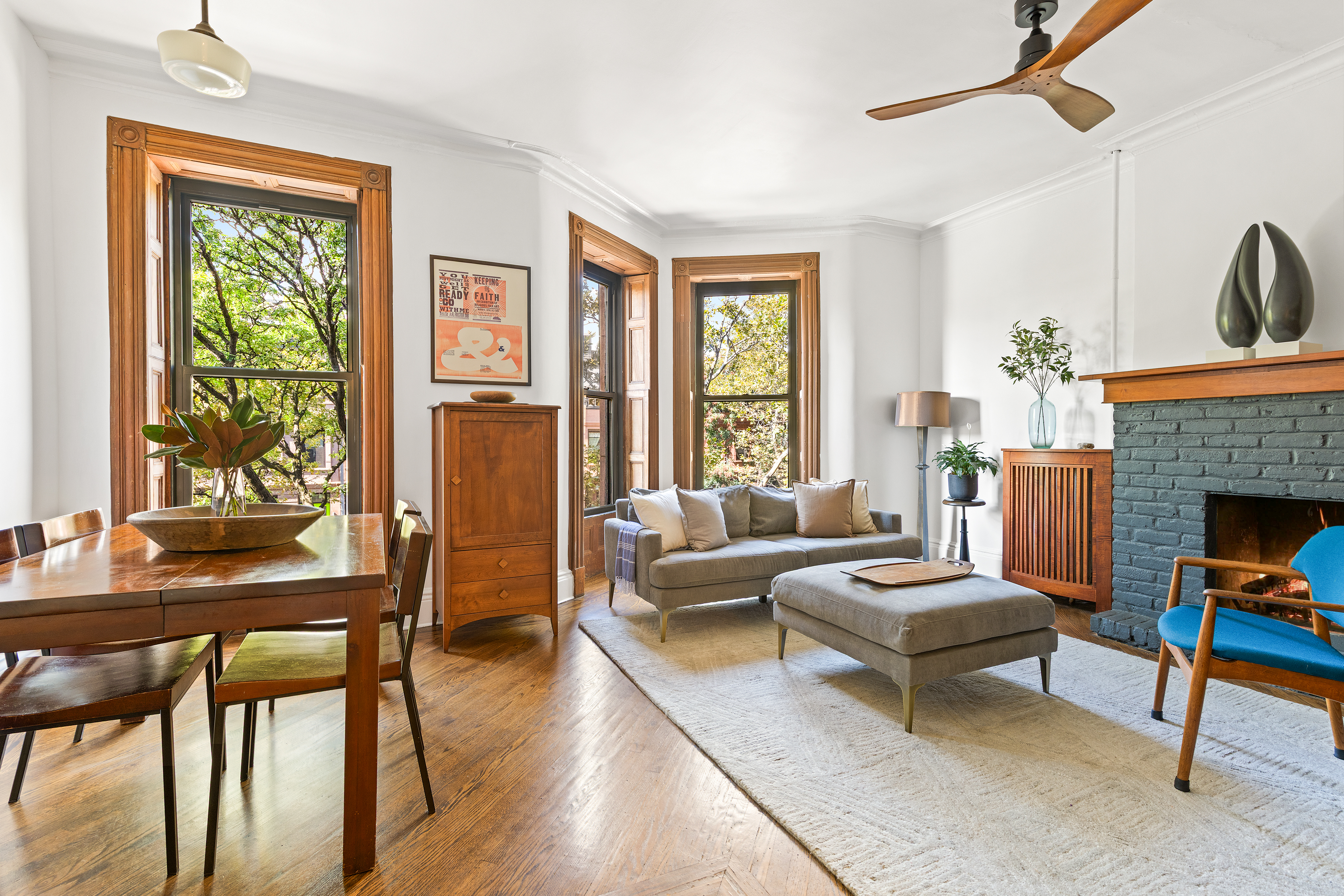 a living room with furniture and a fireplace