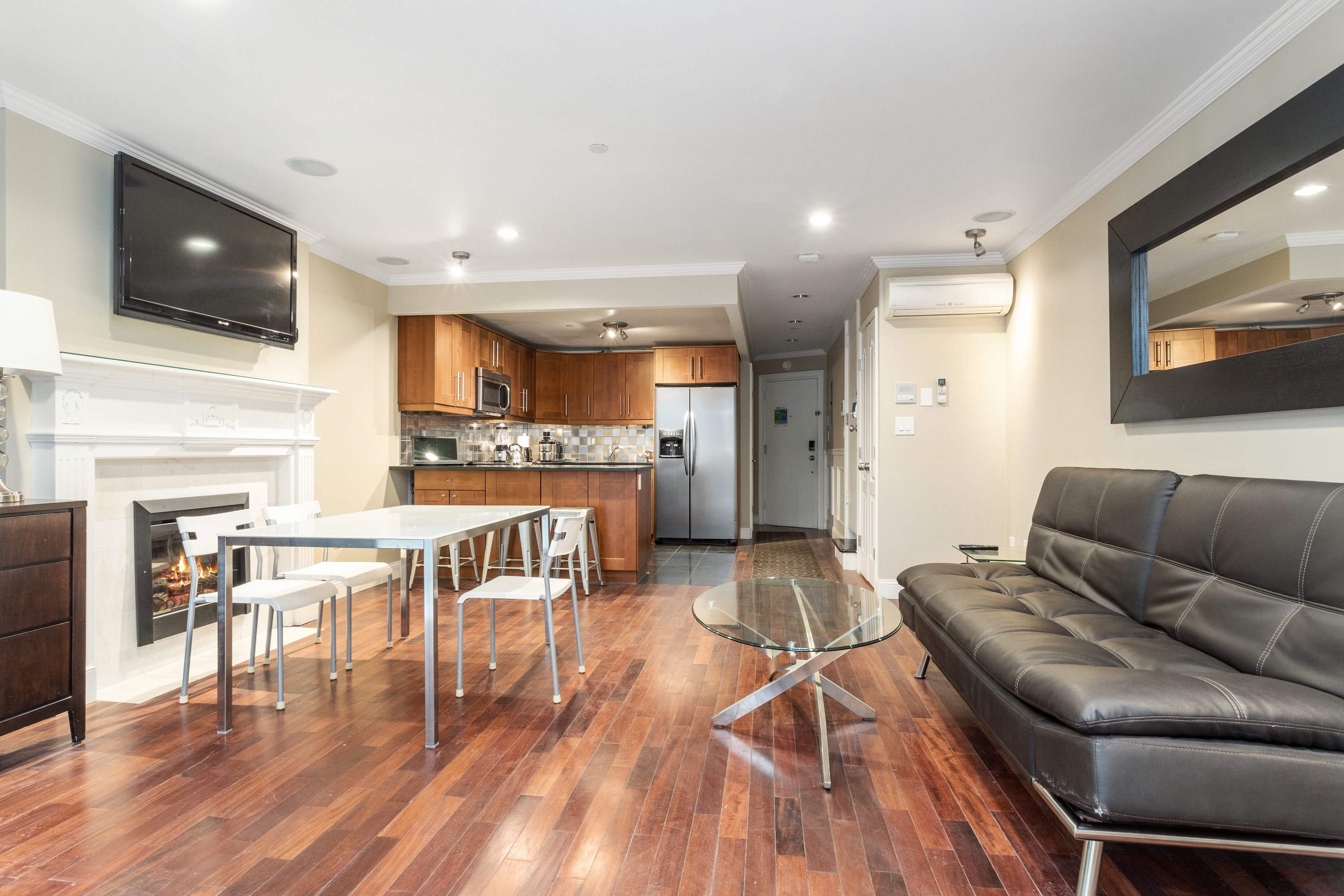 258 West 71st Street, Unit BR Manhattan, NY 10023 - Photo 5 of 13 a living room with furniture and a flat screen tv