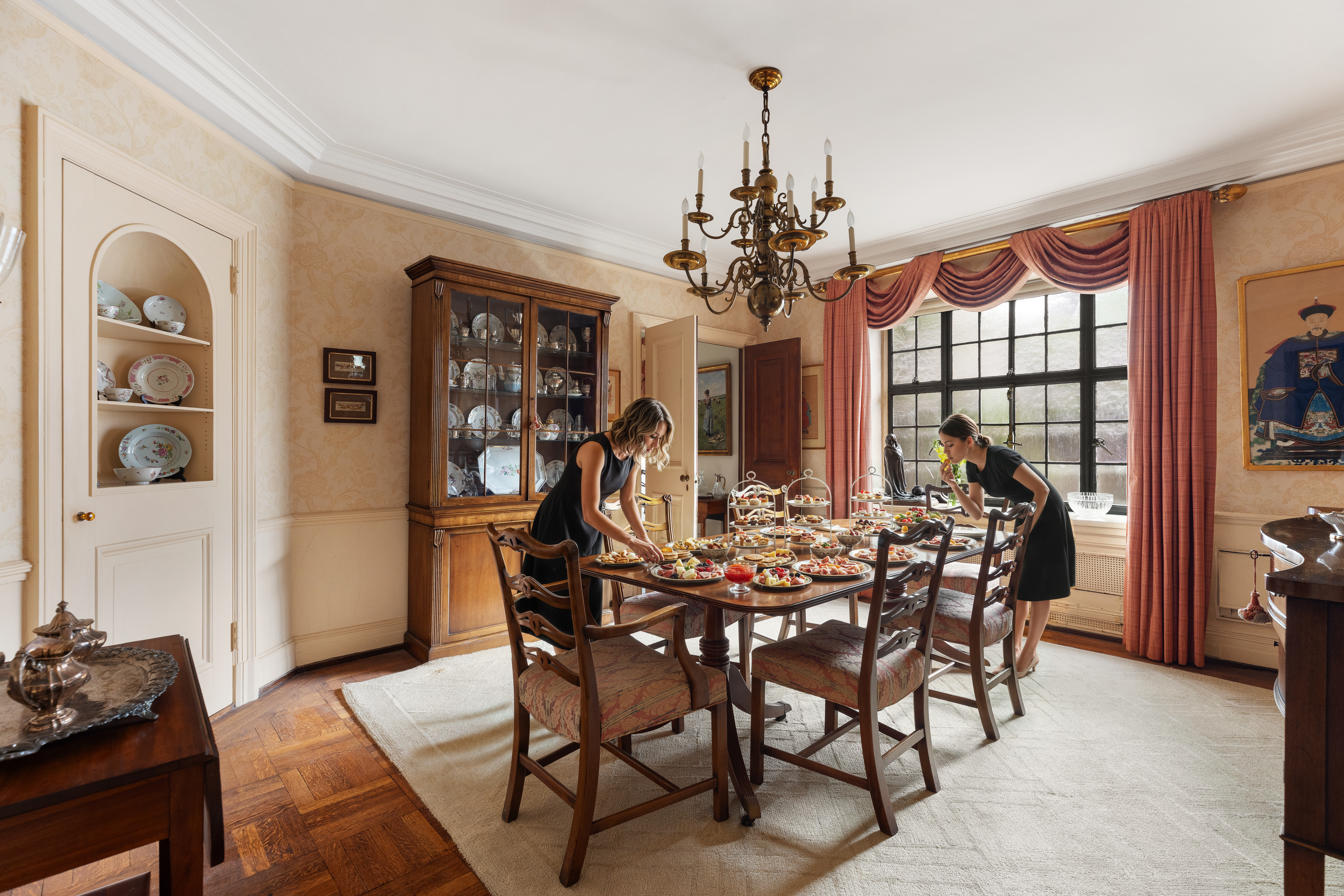 136 East 79th Street, Unit 4B Manhattan, NY 10075 - Photo 2 of 14 a view of a dining room with furniture and chandelier