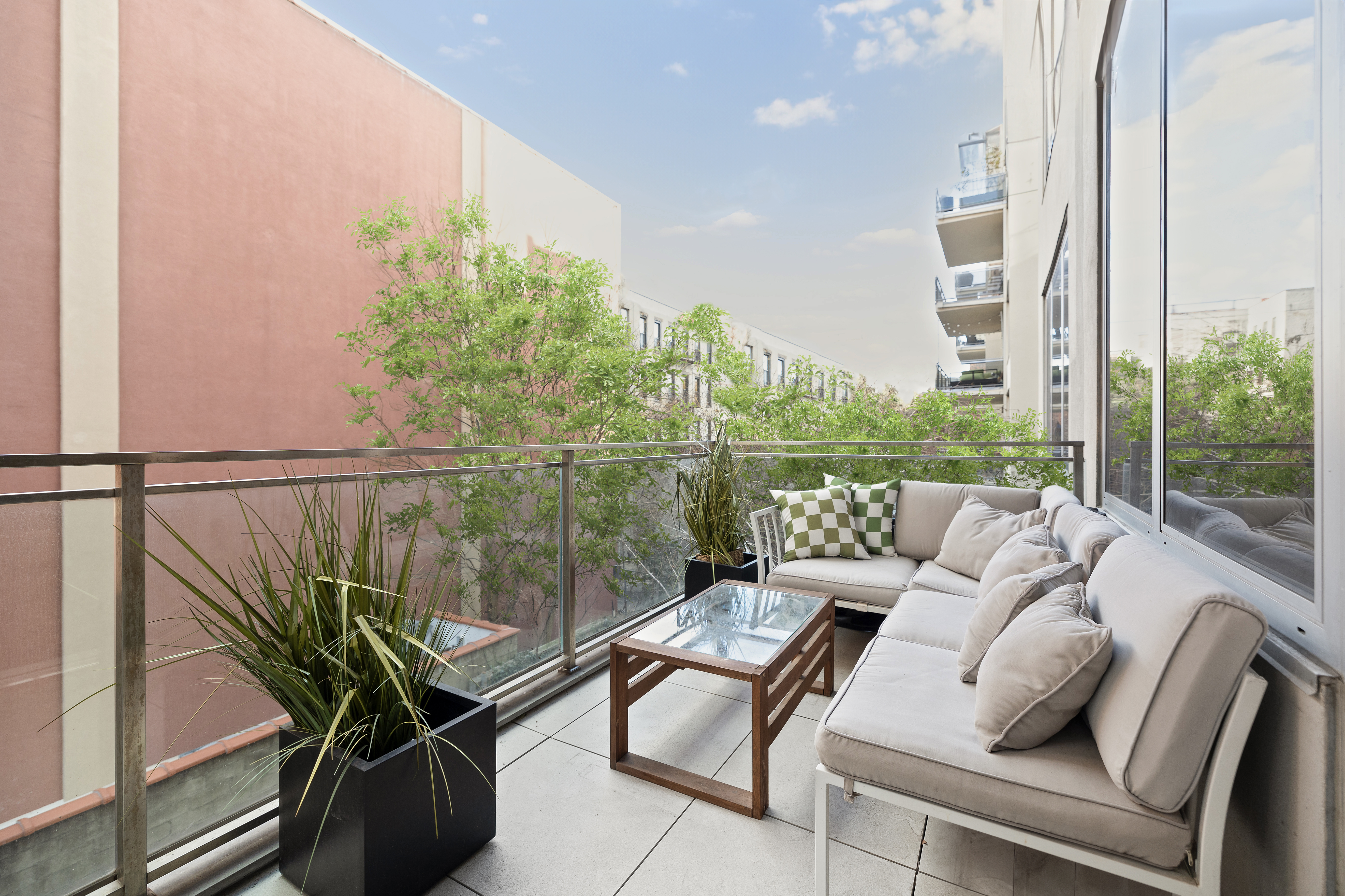 129 West 123rd Street, Unit 3 Manhattan, NY 10027 - Photo 16 of 20 a balcony with couple of chairs and a potted plant