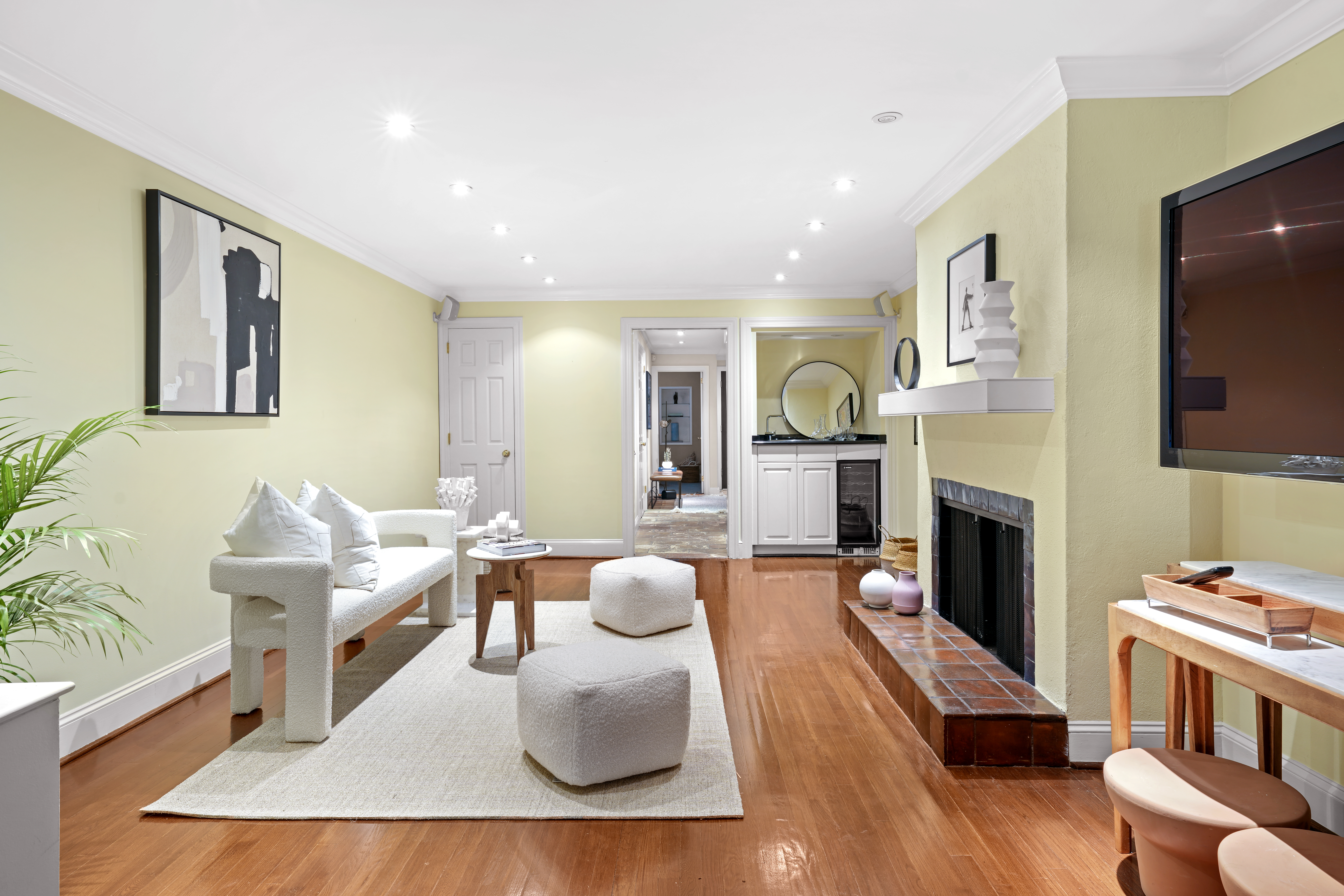 247 East 71st Street Manhattan, NY 10021 - Photo 6 of 31 a living room with furniture fireplace and flat screen tv