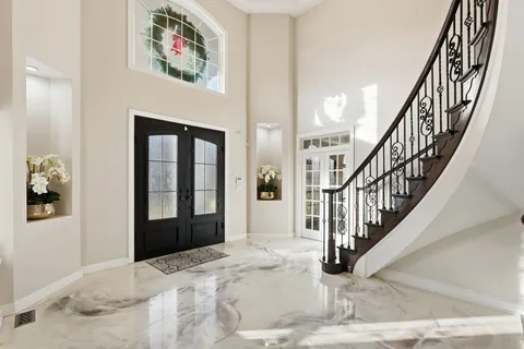 a view of entryway and hall with wooden floor