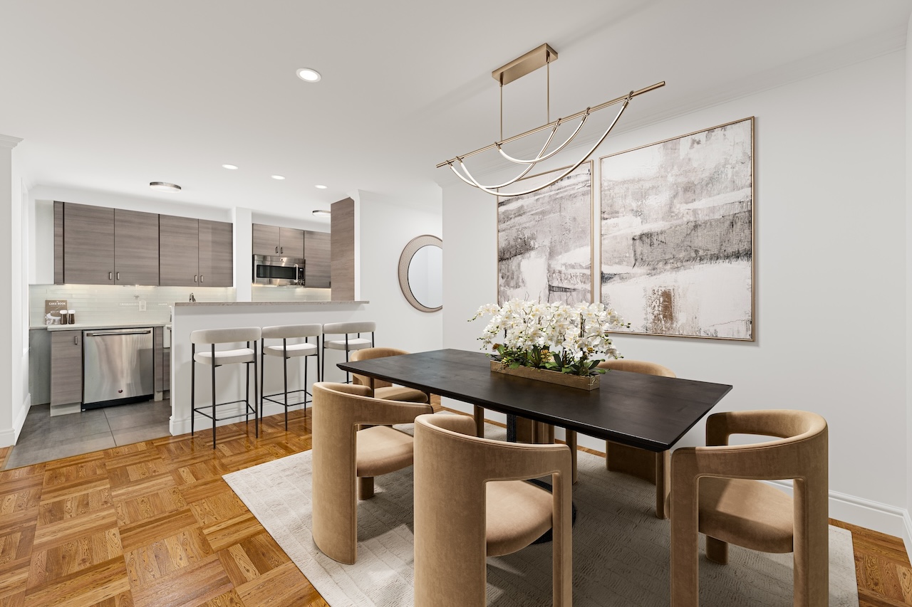 302 East 88th Street, Unit 2G Manhattan, NY 10128 - Photo 7 of 16 a kitchen with granite countertop a stove a table and chairs in it