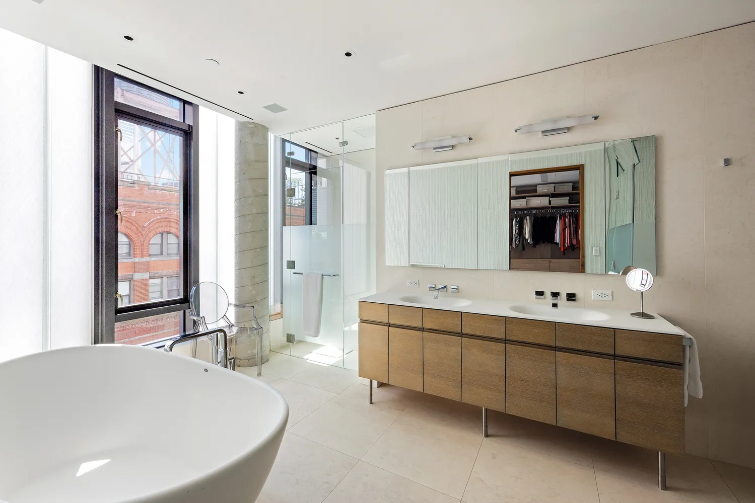 a bathroom with a tub sink and mirror