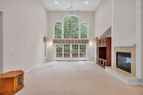 a large kitchen with granite countertop a large window