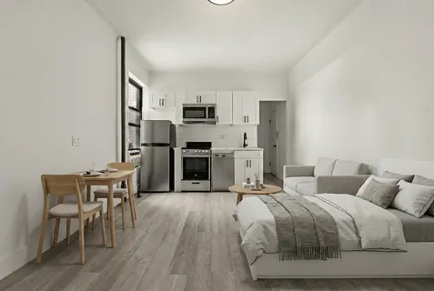 a spacious bedroom with a bed and furniture