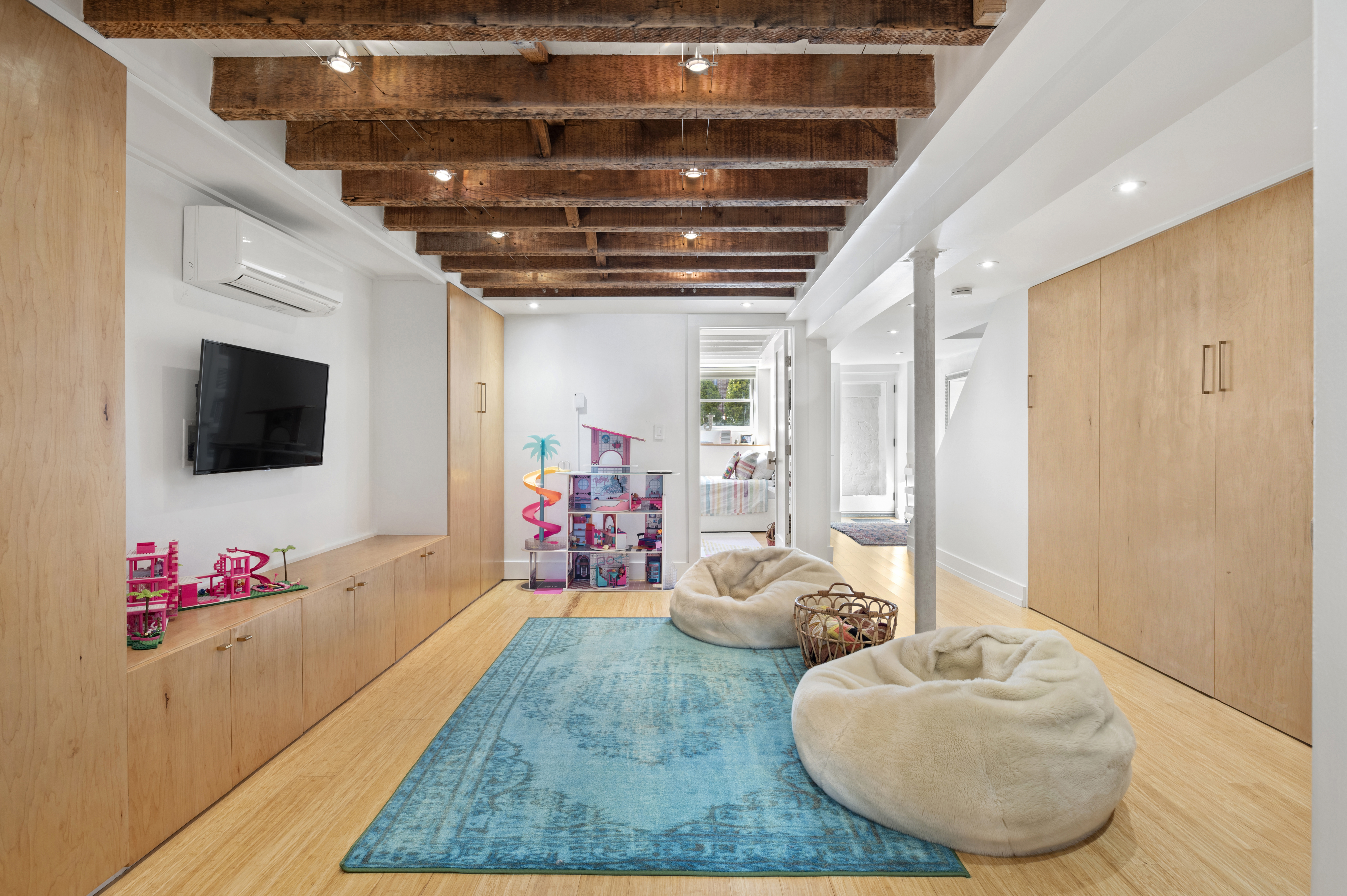 185 East 31st Street Brooklyn, NY 11226 - Photo 10 of 23 a living room with furniture and a flat screen tv