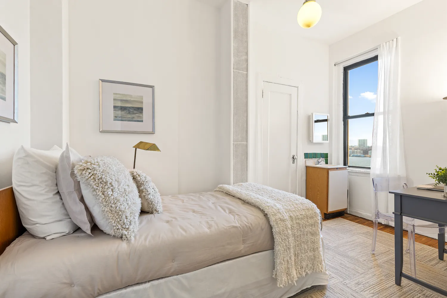 a bedroom with a bed and a table