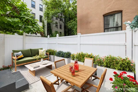 a outdoor living space with furniture and garden view
